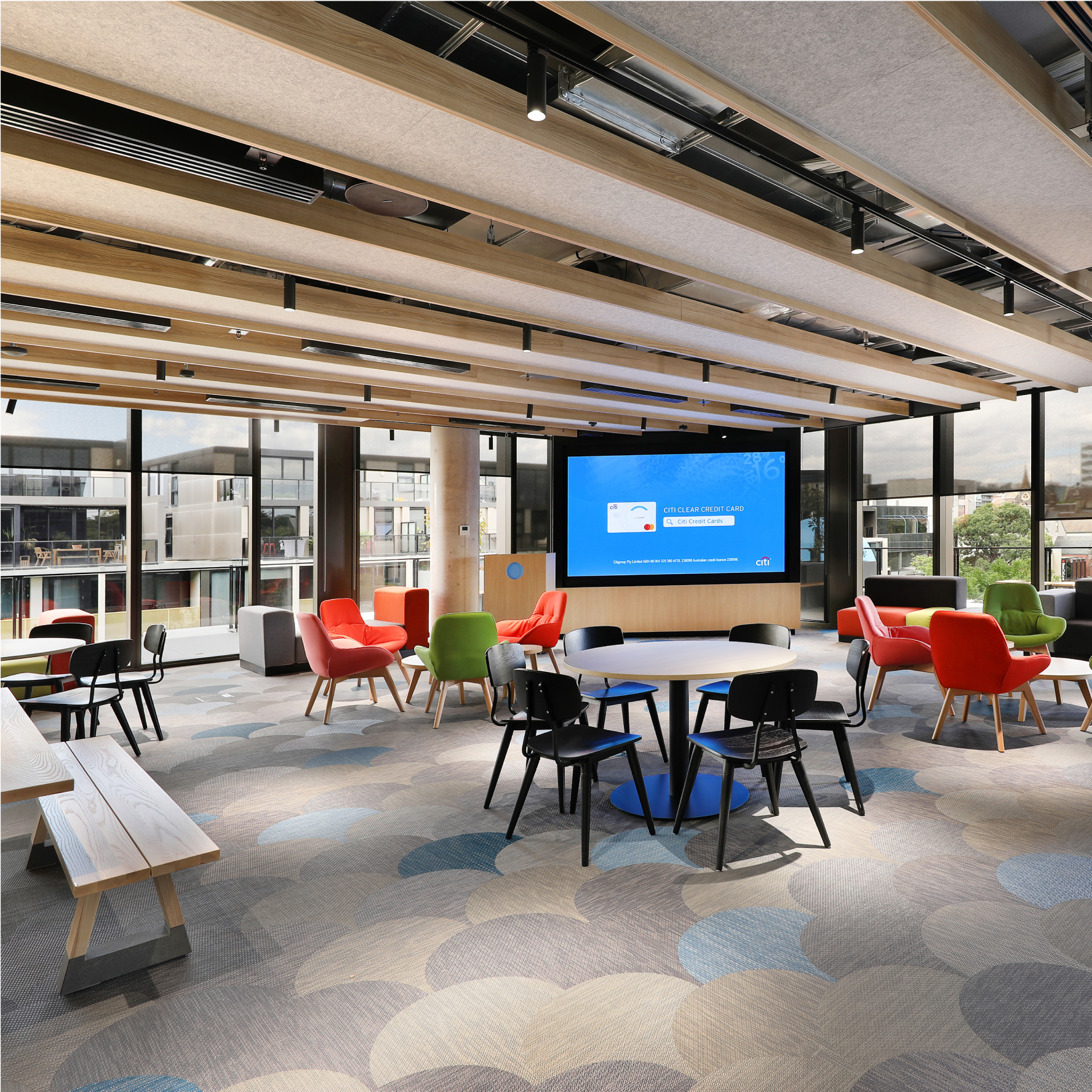A large, light, open office space with varied seating arrangements where Xero employees can meet or take a break.