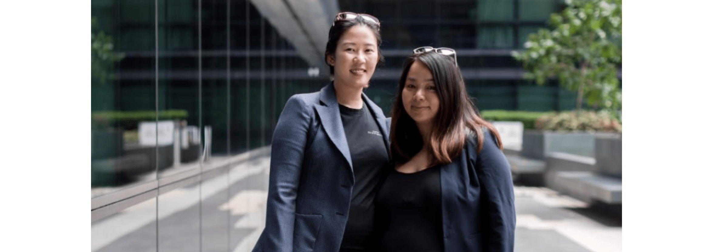 Aprilina Loh and Samantha Sam from CPA Connects standing together in a courtyard.