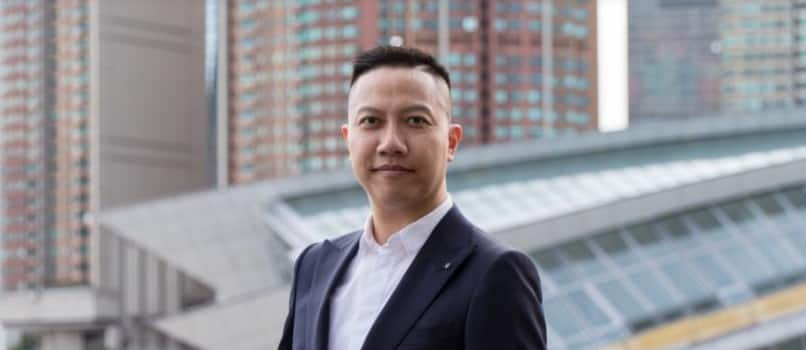 Rex Leung of Linkers CPA standing on a city balcony.