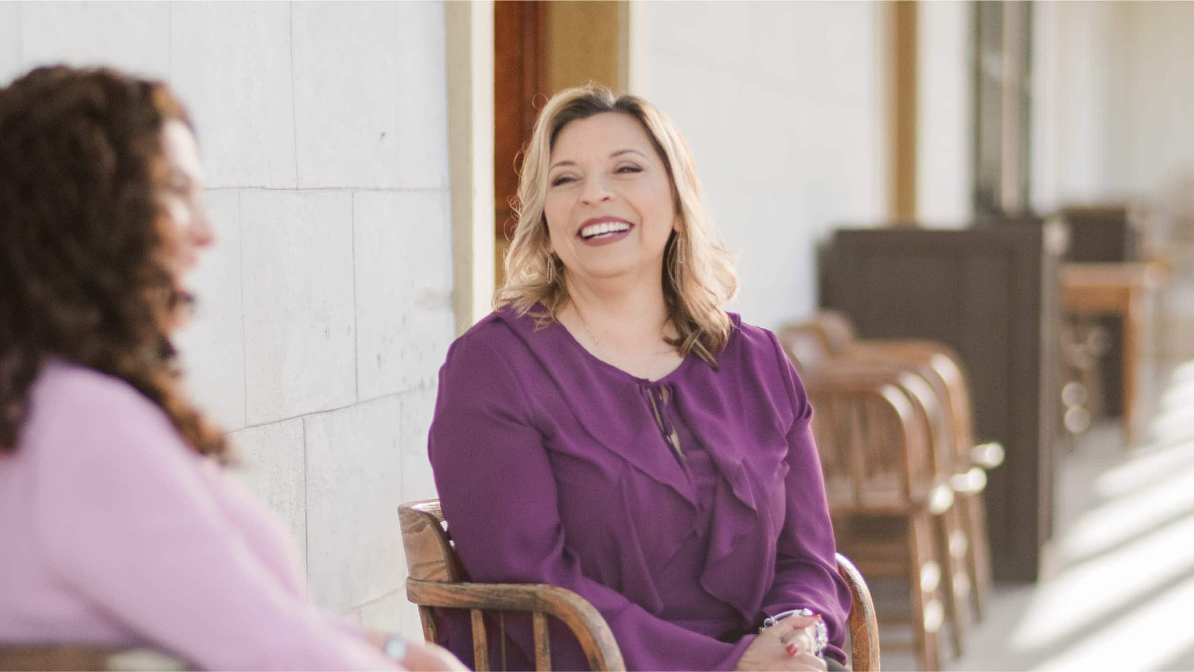 Nury Saenz, Xero-certified bookkeeper, talks with a client.