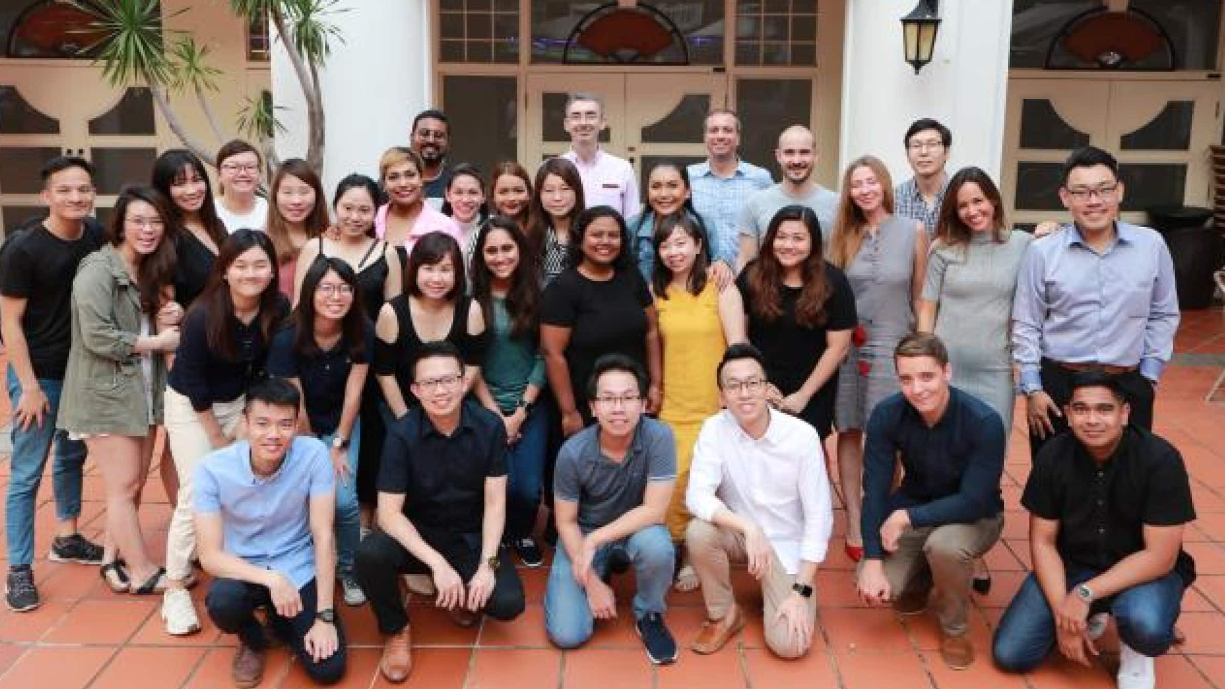 The Osome team gathered together in front of a building for a group photo.