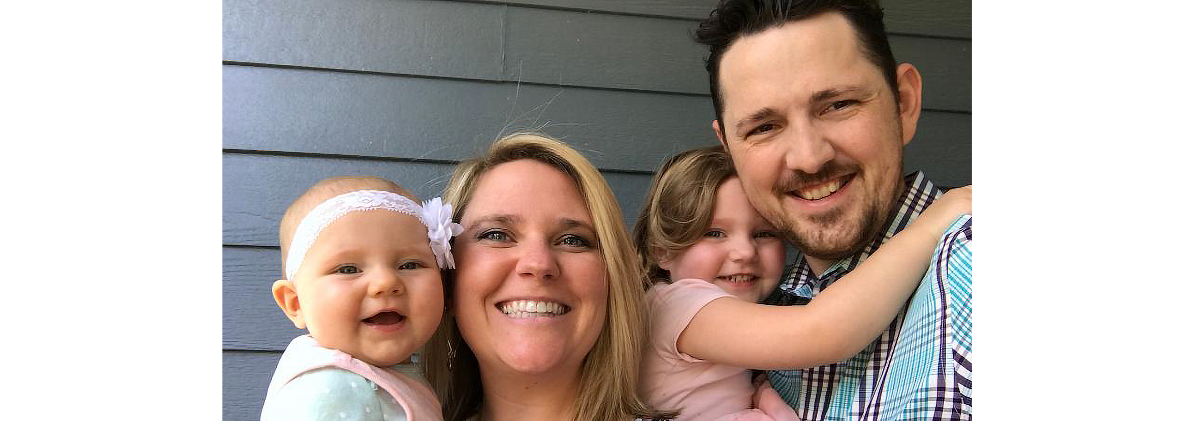 Tate Henshaw with his wife and two young children.