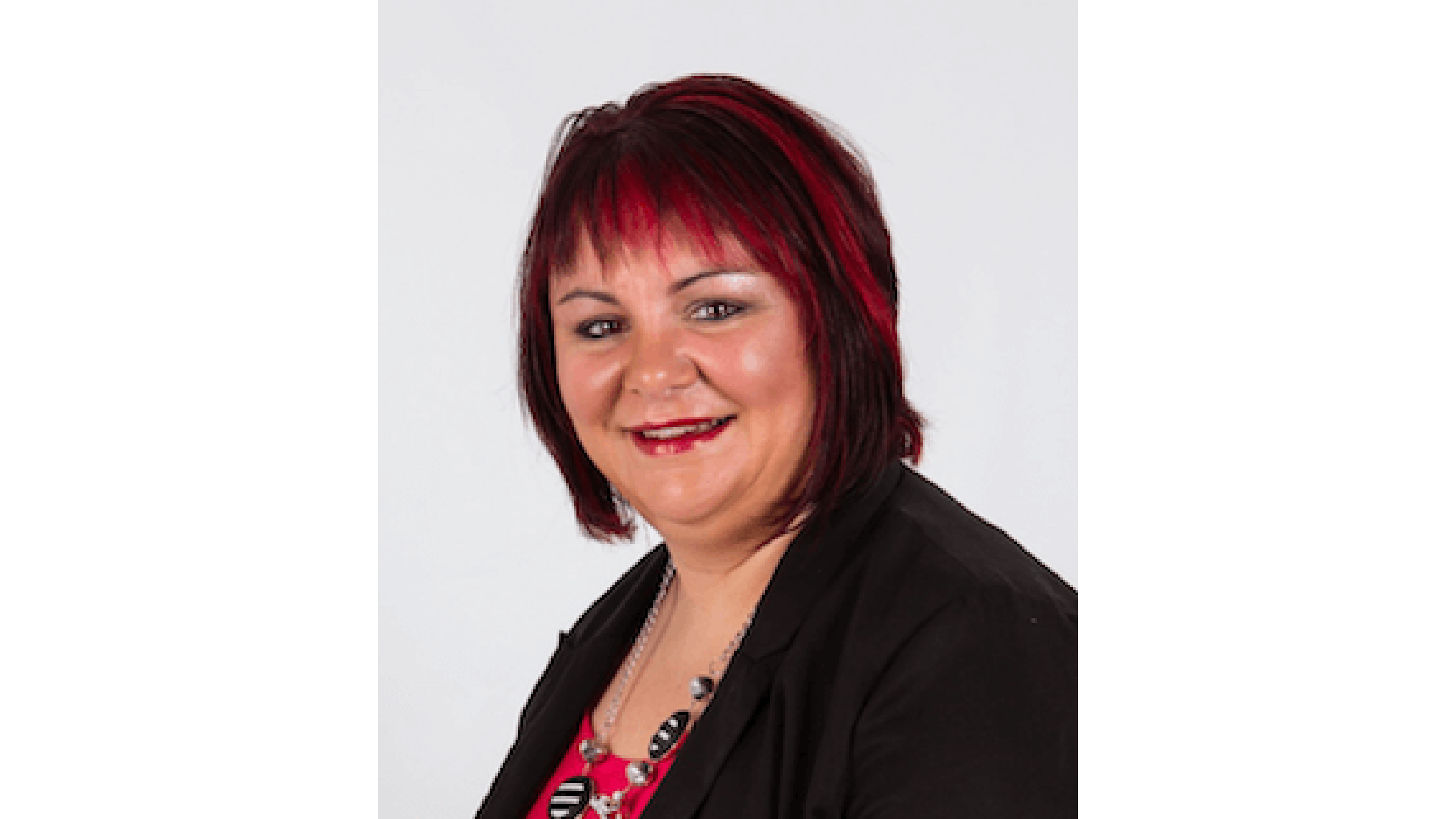 Janine Gartner from Tax Agent 99 against a white background smiling to camera.