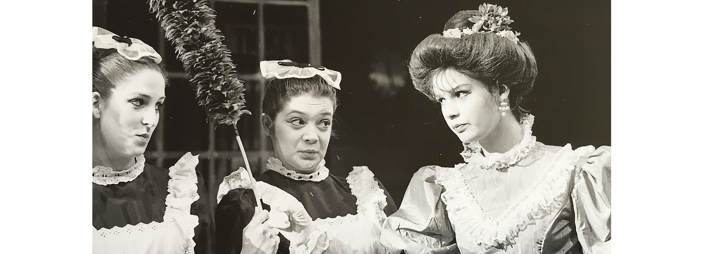 Black and white photo of Melanie in a ballet production dressed as Aunt Polly. 