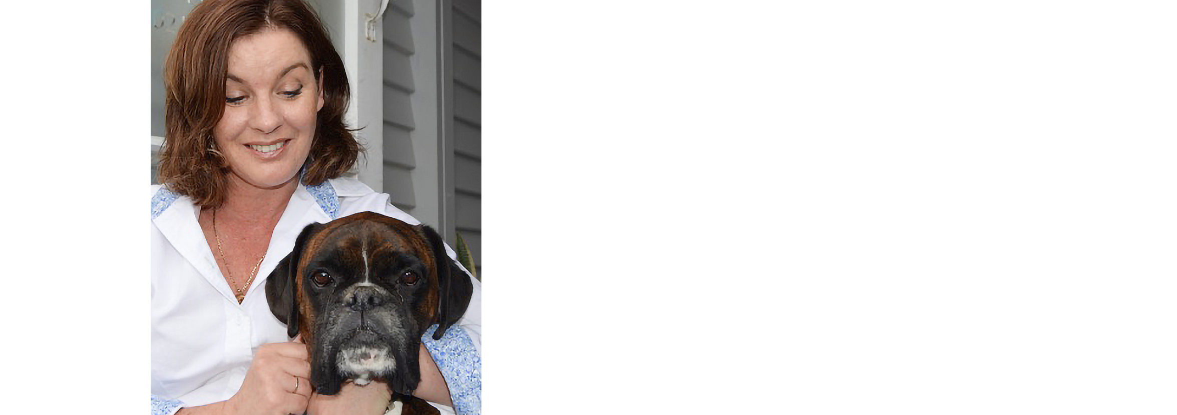 Melanie candidly giving her dog a pat on the head.