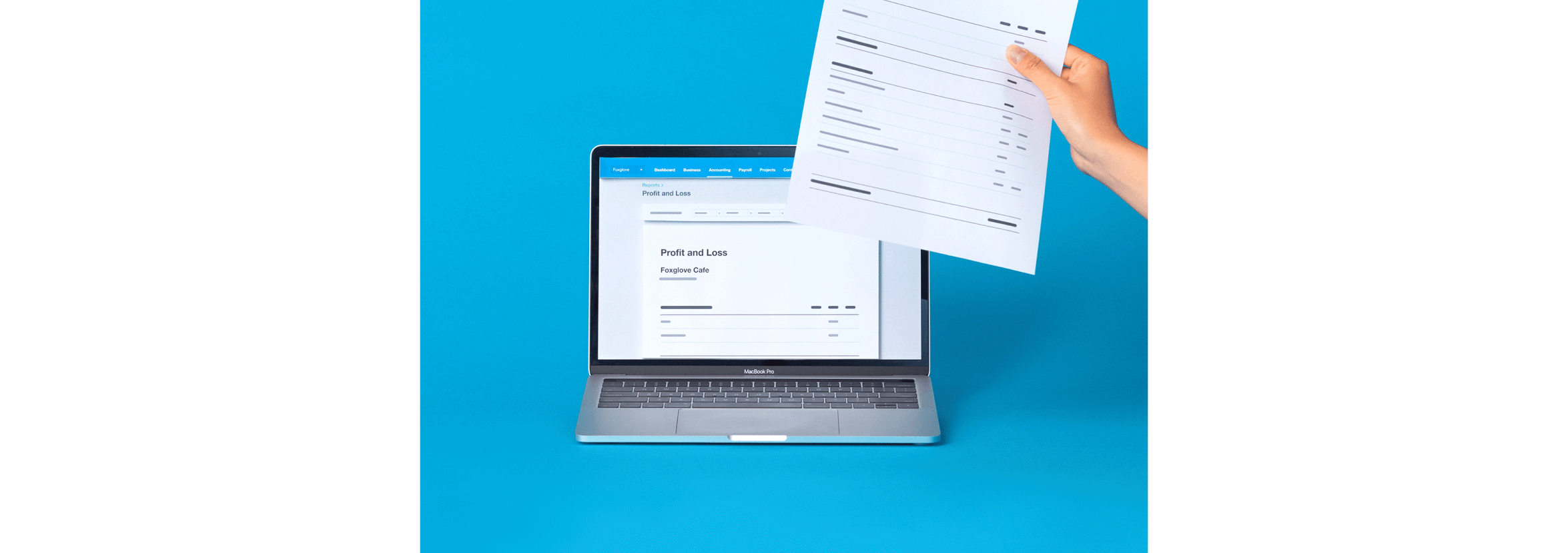 A computer is open on a Xero profit and loss screen, with a hand beside it holding a financial paper.
