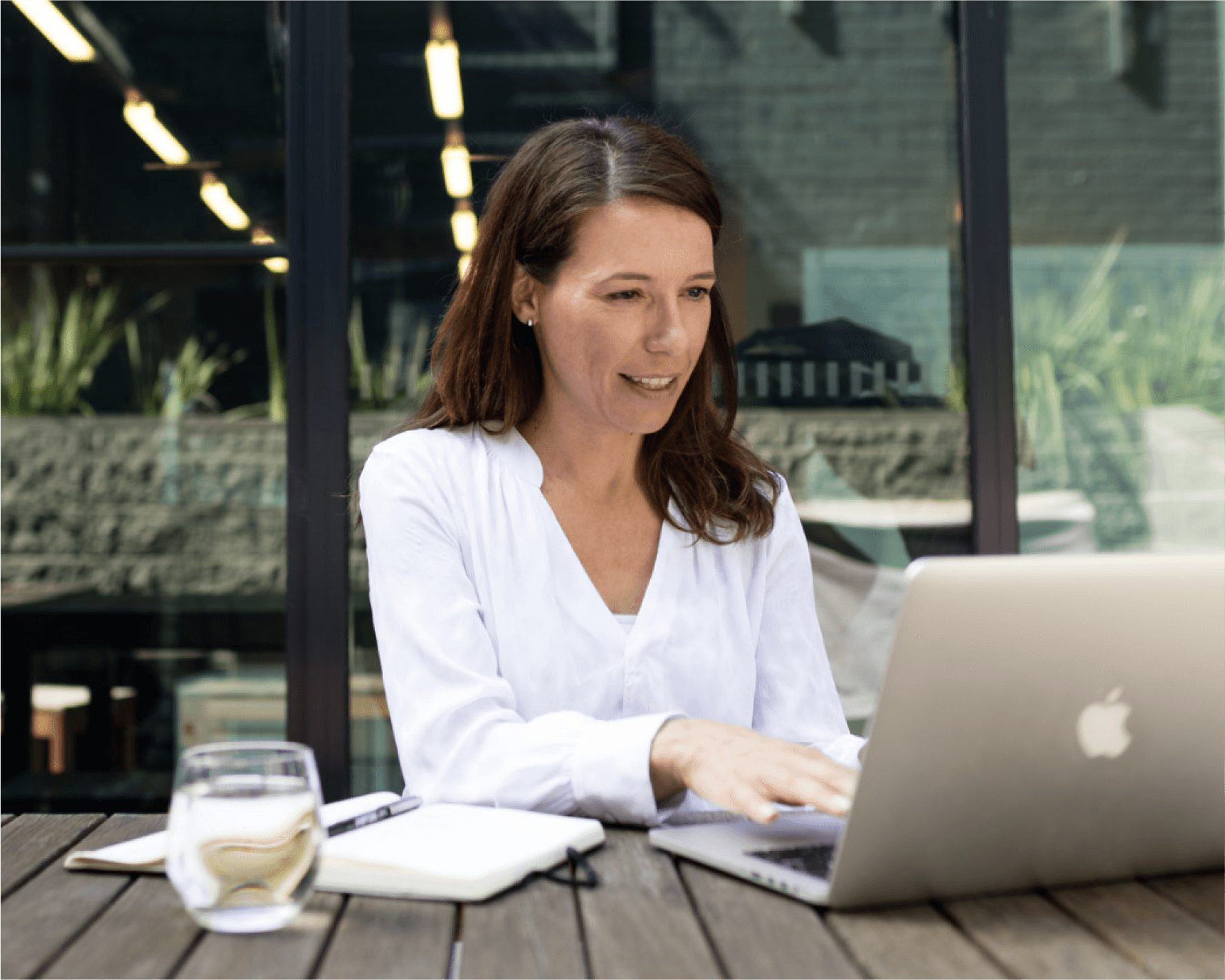 The owner of a law firm tracks business expenses on their laptop.