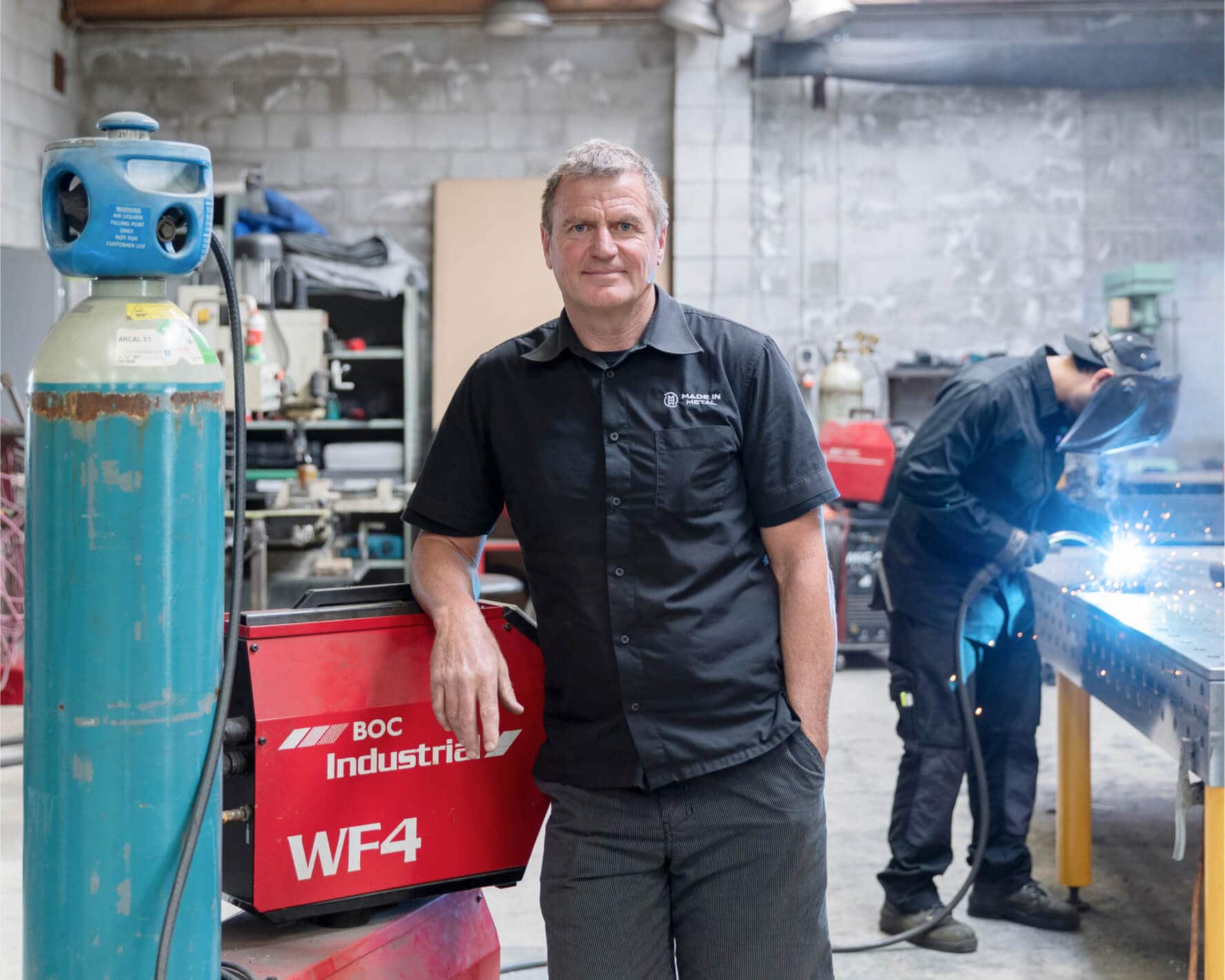 An industrial manufacturer who uses Xero accounting software and his team weld components.