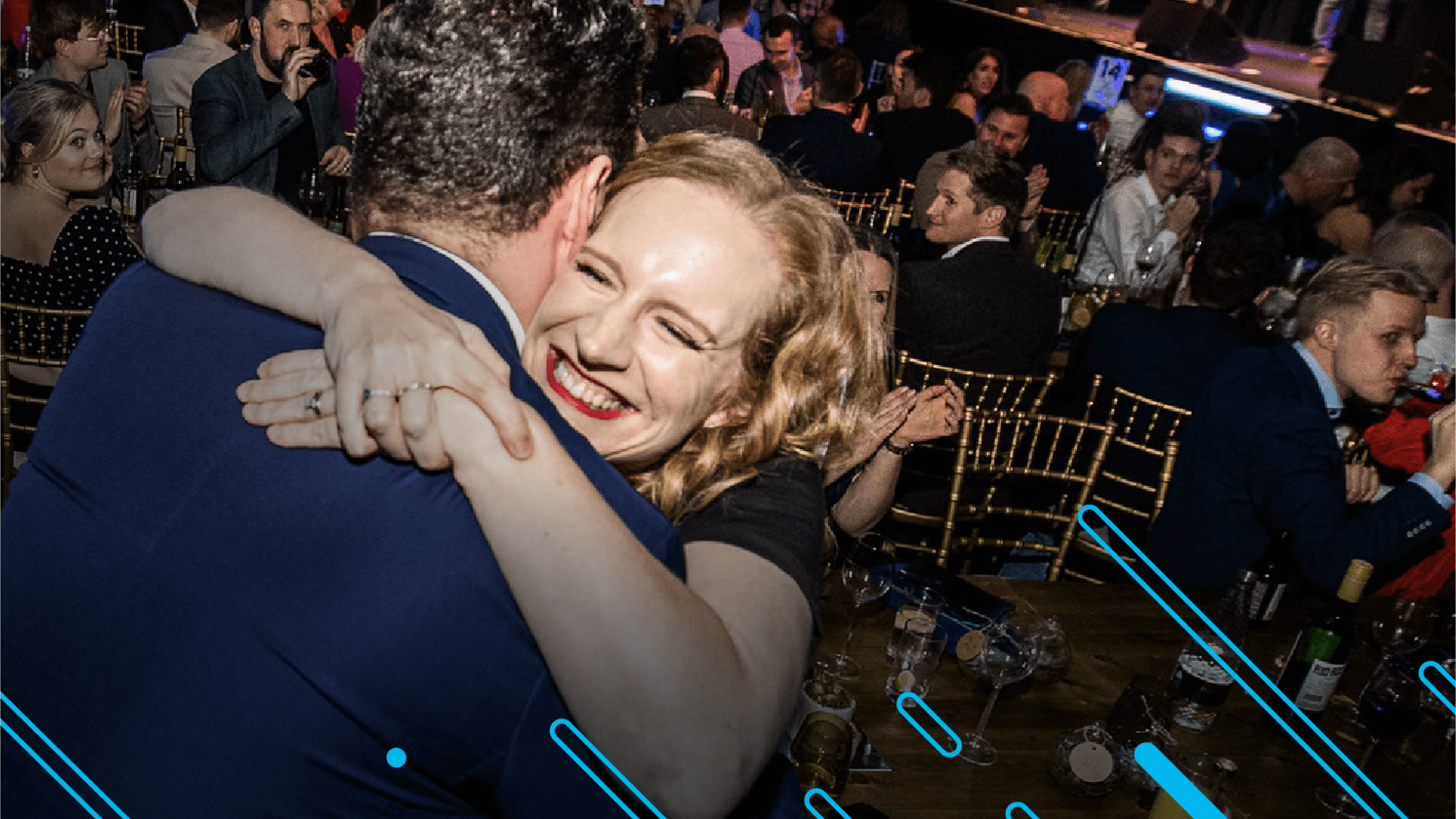 Two colleagues hug when they hear the announcement that their pratice has won a Xero Award.