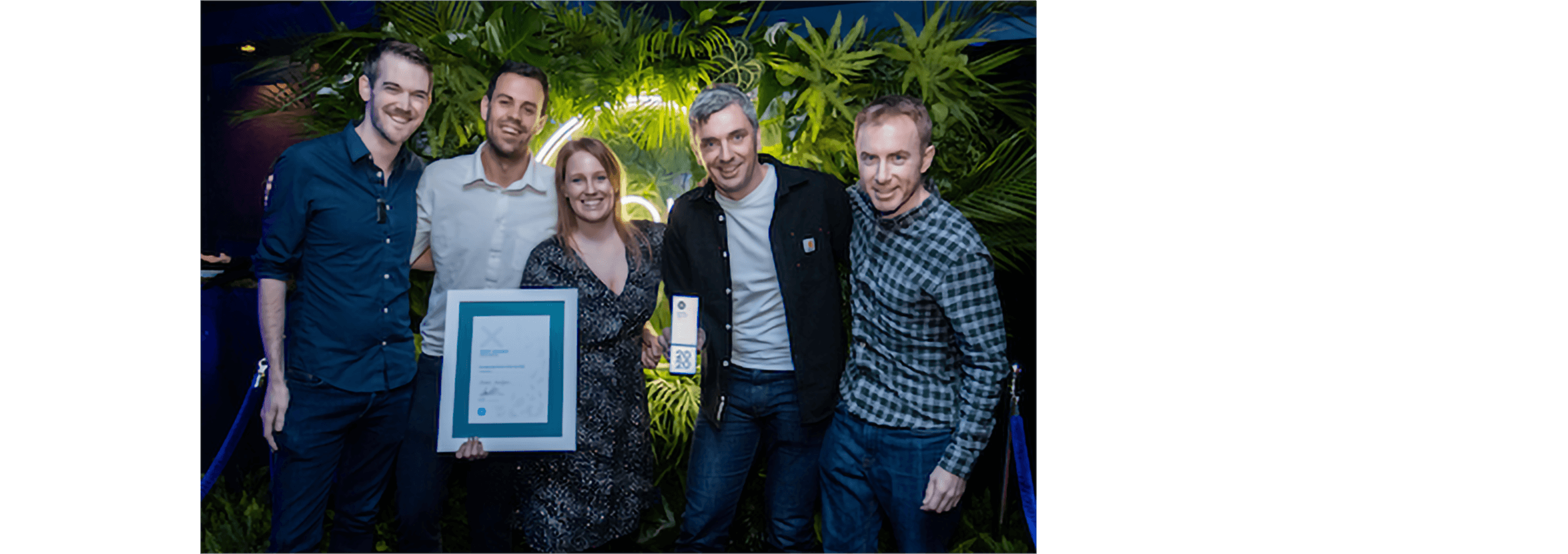 Members of the Xavier Analytics team celebrate winning the Emerging App of the Year award.