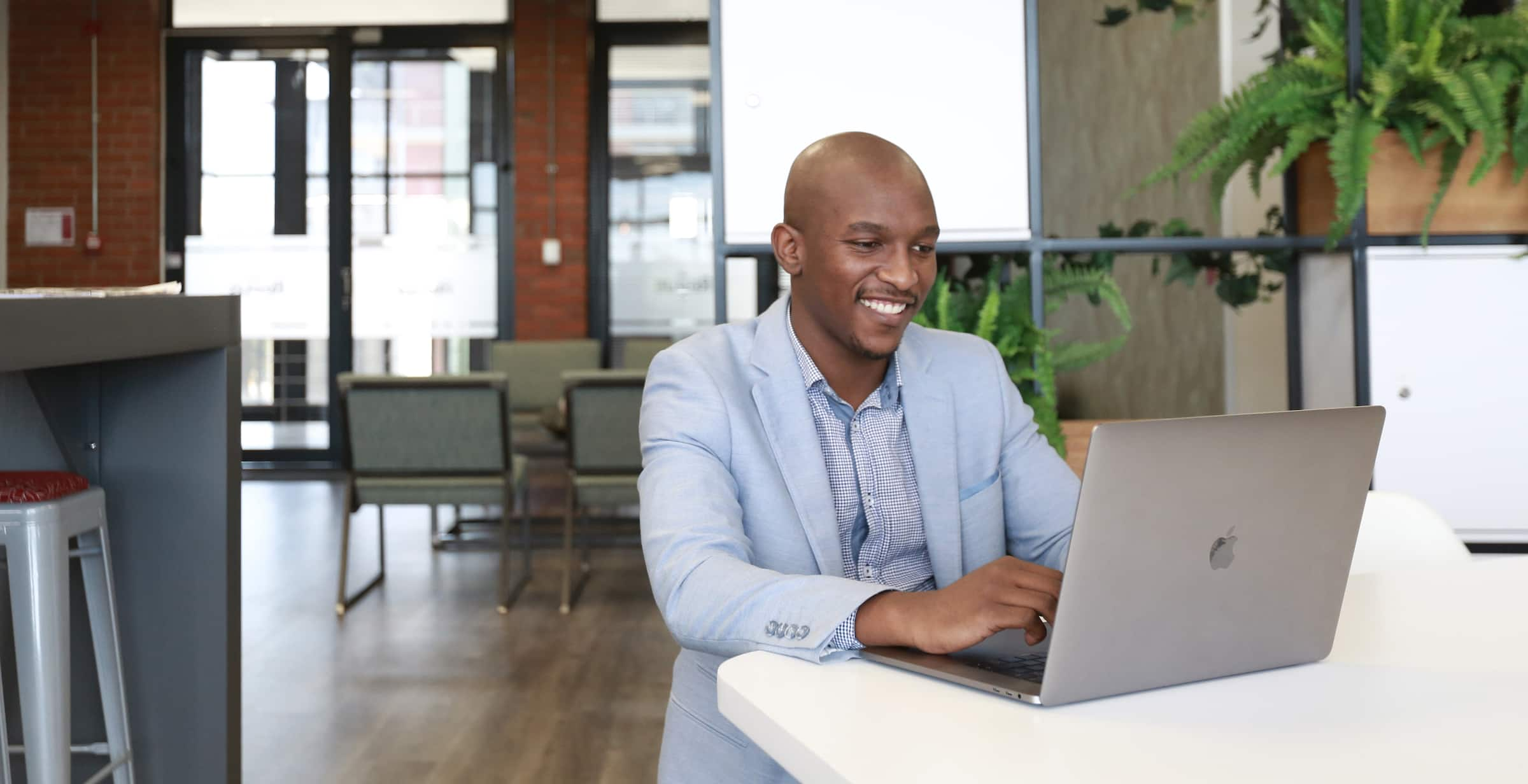 A small business owner has their laptop open and is excited to get up and running with Xero.