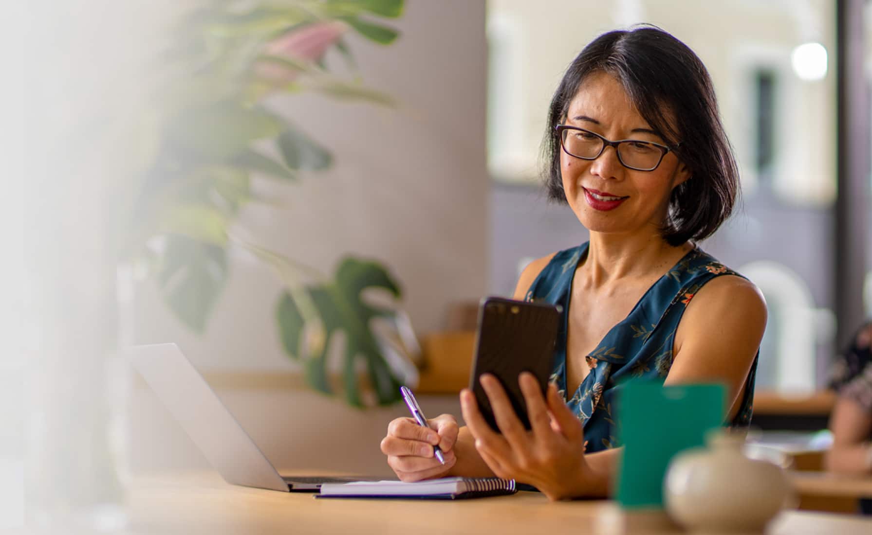 Two small business owners chat about multi-factor authentication over coffee.
