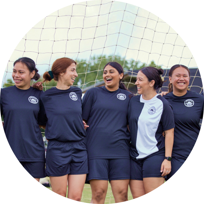 Image of a team of football players standing in front of a goal