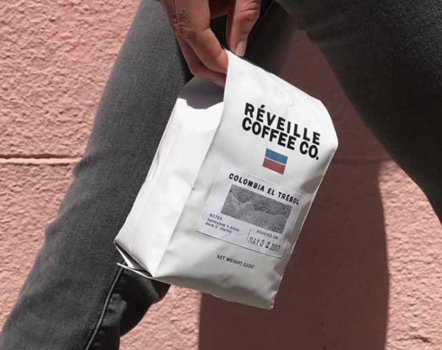 person holding bag of Réveille coffee