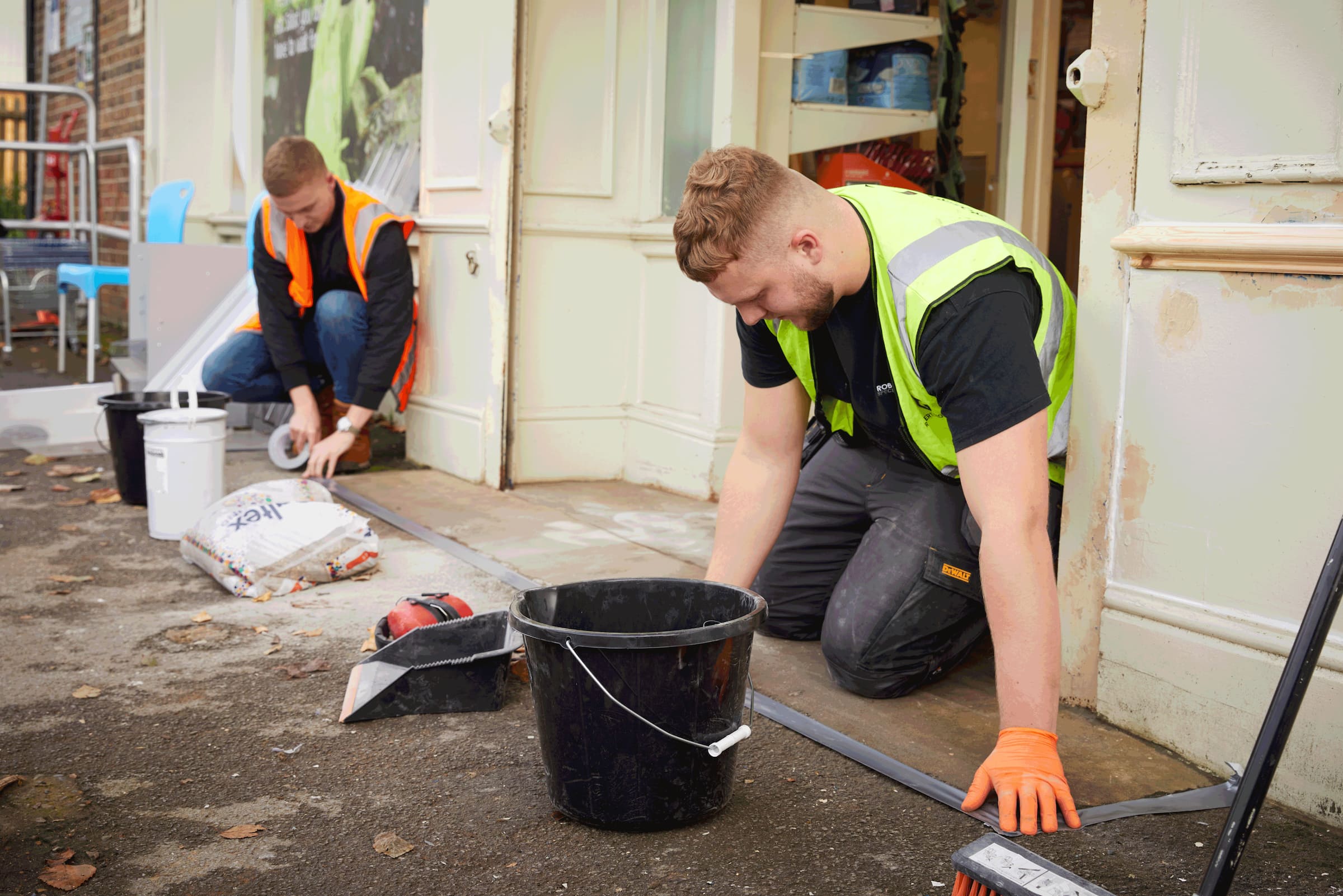 Harry and Jack from Robert George working on some flooring