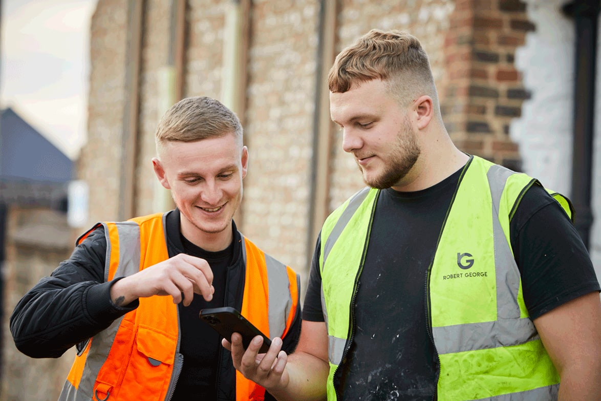 Robert George Flooring team looking at Xero on mobile