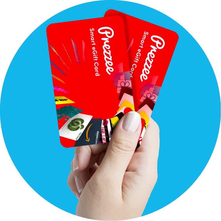 Two red Prezzee cards are being held