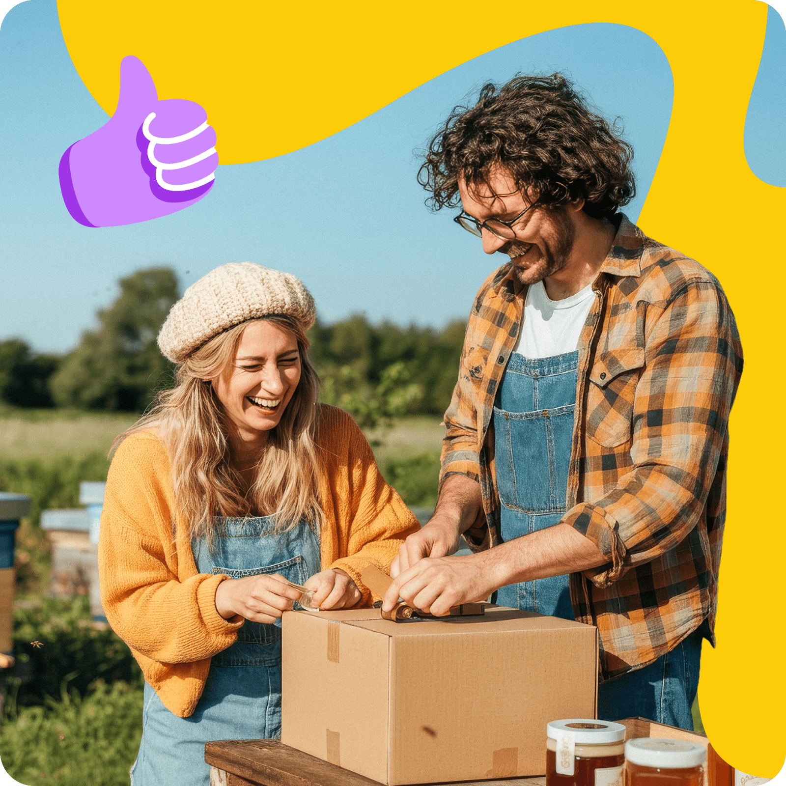 Two small business owners packing a box