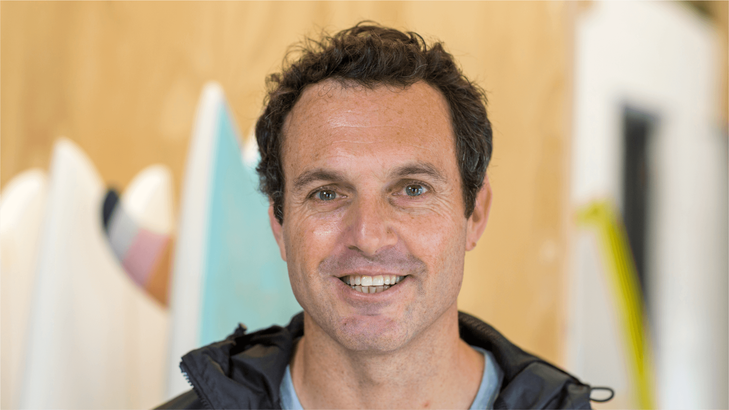 Craig Paul, co-founder of York Surf in Cape Town, in front of some of his surfboards.