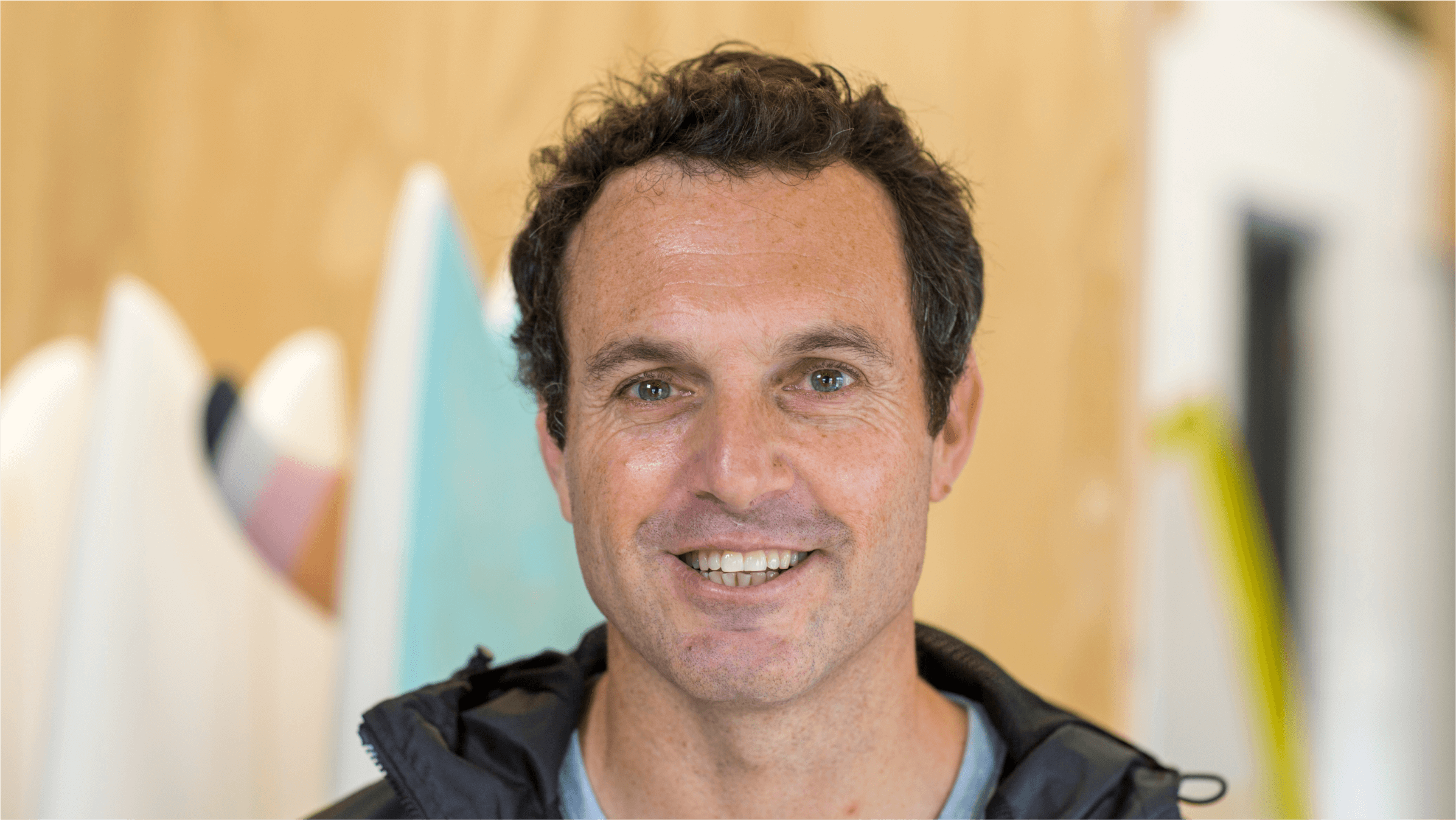 Craig Paul, co-founder of York Surf in Cape Town, in front of some of his surfboards. 