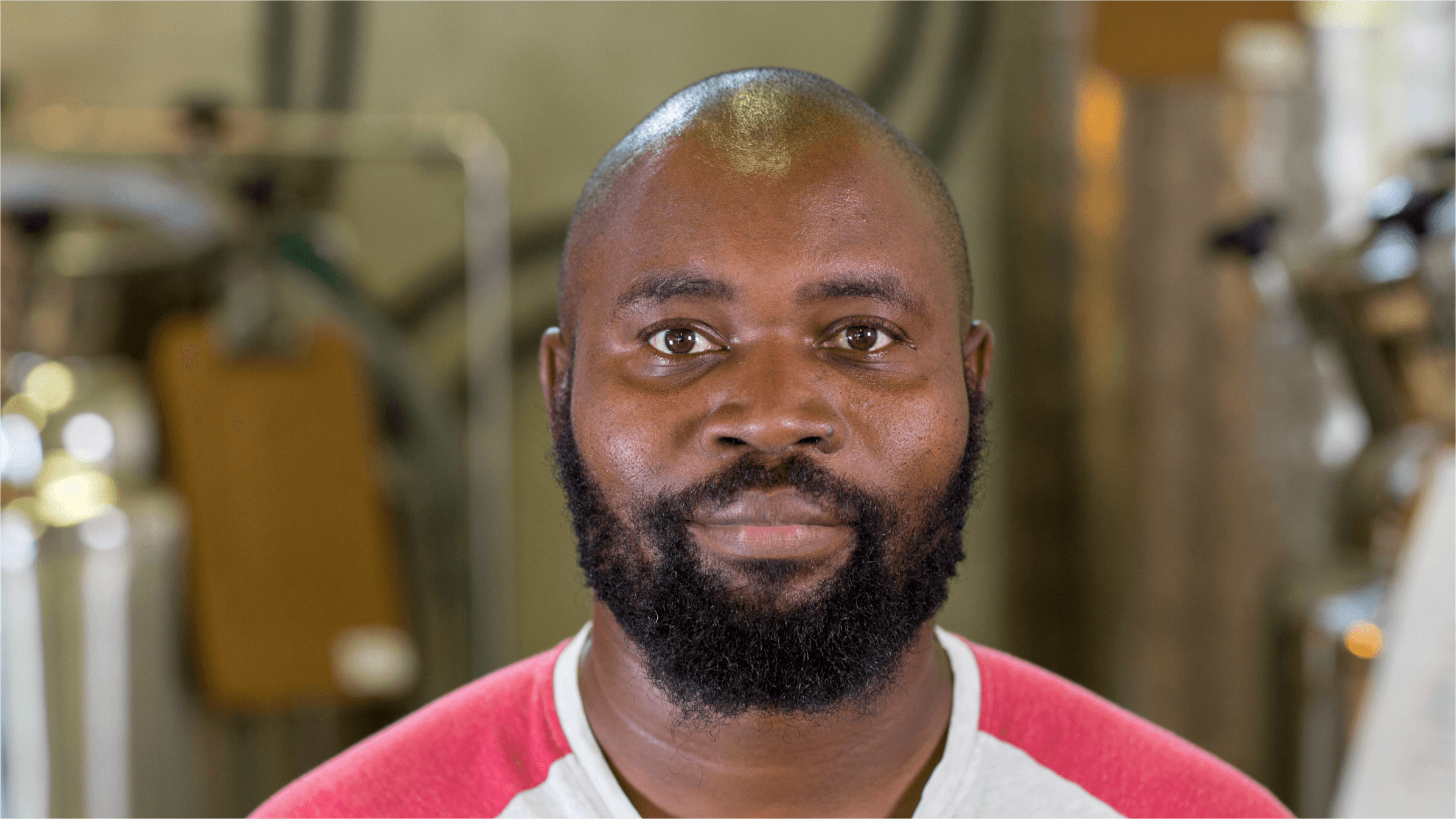 Head of shoulders photo of Lethu Tshabangu in his Cape Town-based brewery.