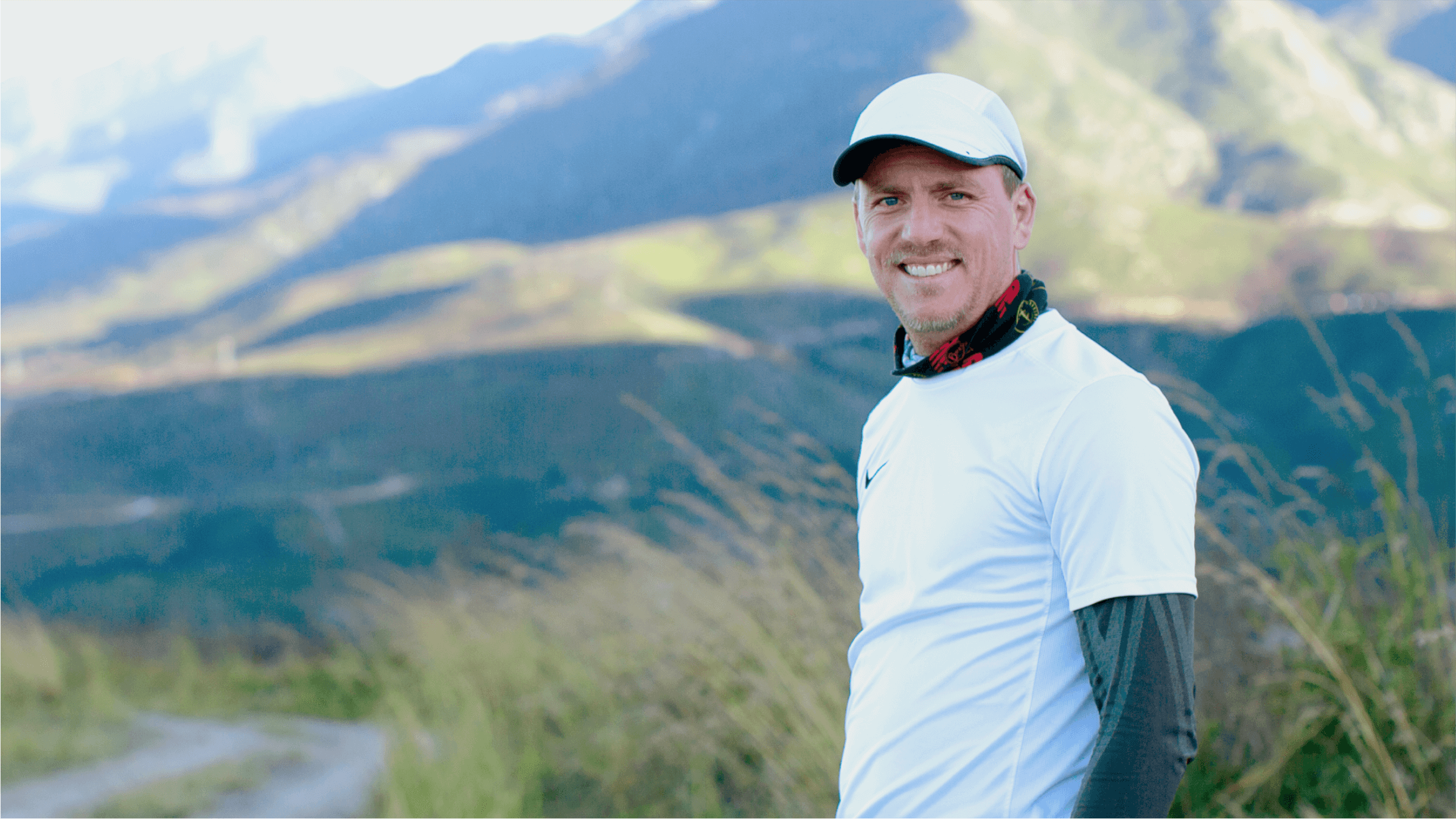 hoto of Willem Haarhoff from DoughtGetters Accounting against a backdrop of mountains.