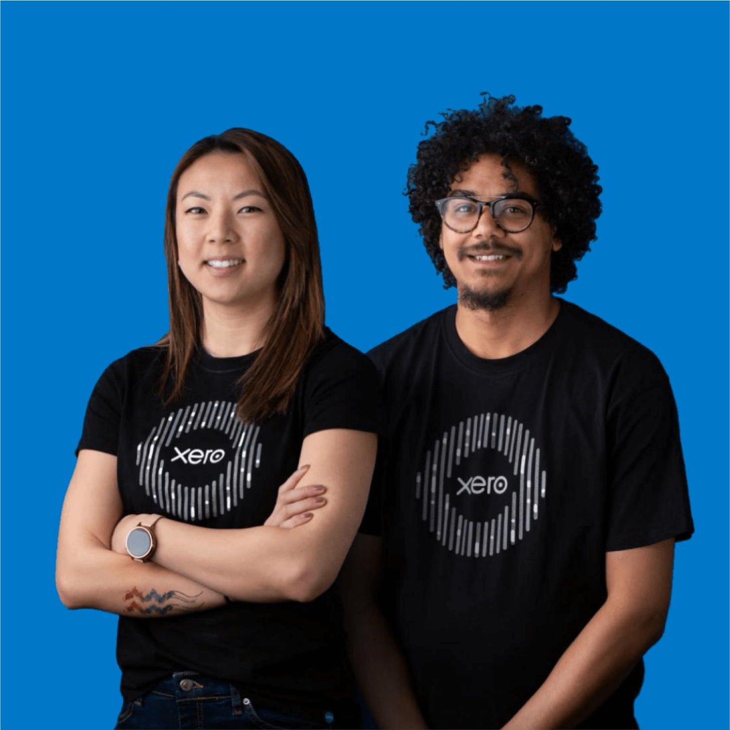 Two Xero account managers wearing block Xero t-shirts