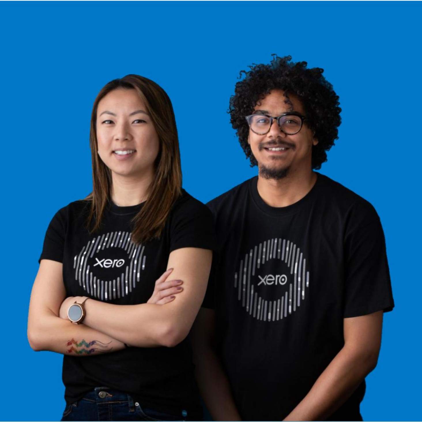 Two Xero account managers wearing Xero t-shirts.
