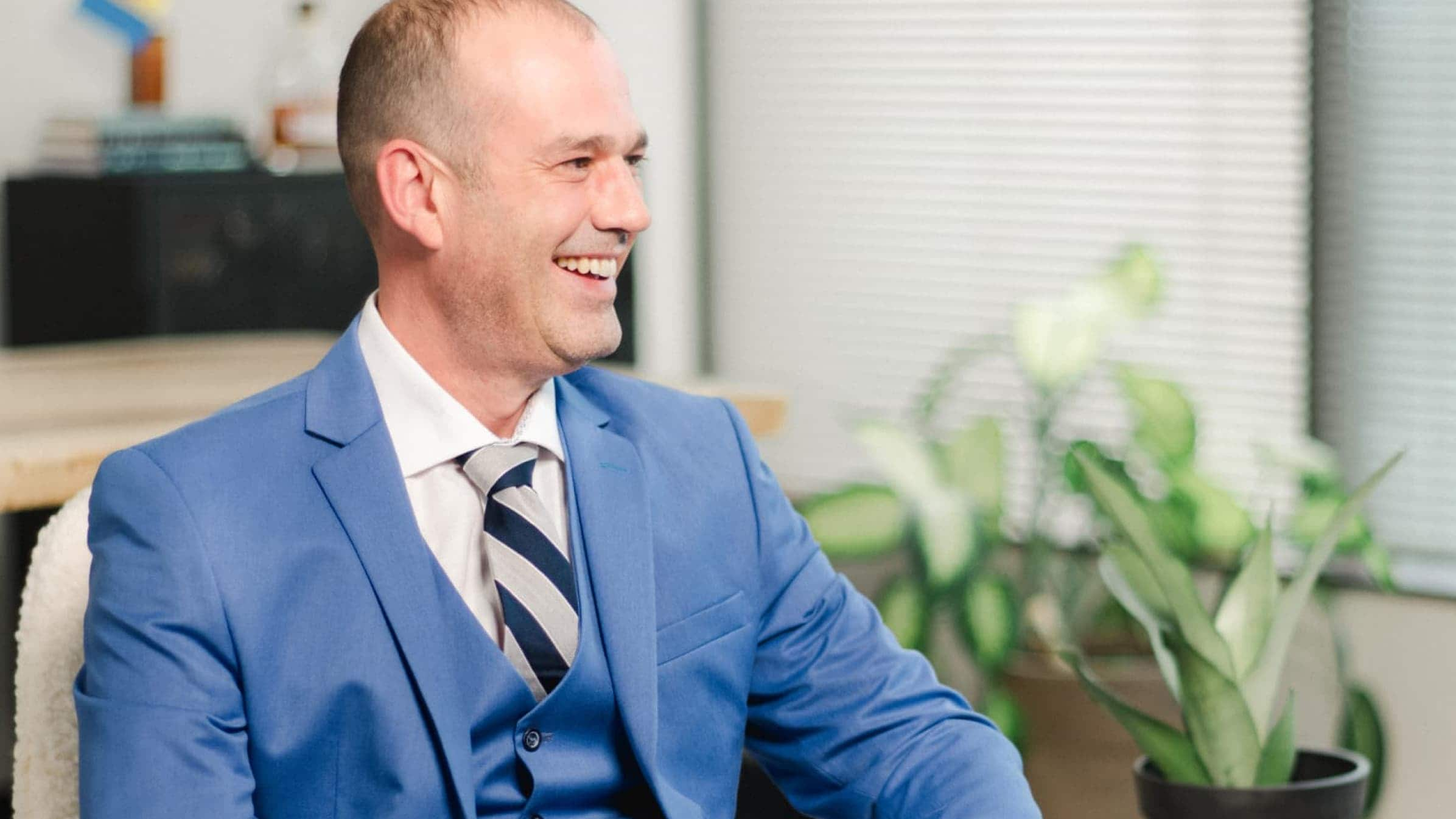 Marc-Eric Blanchette, CEO and founder of Cloudmeb, sits at his office smiling.