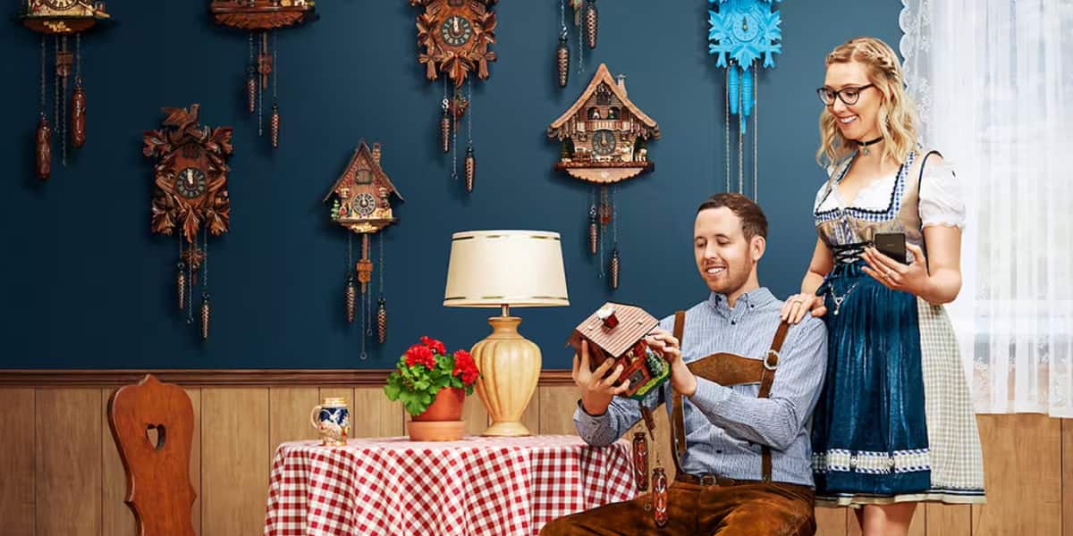 The Schafroth family in a room decorated with cuckoo clocks