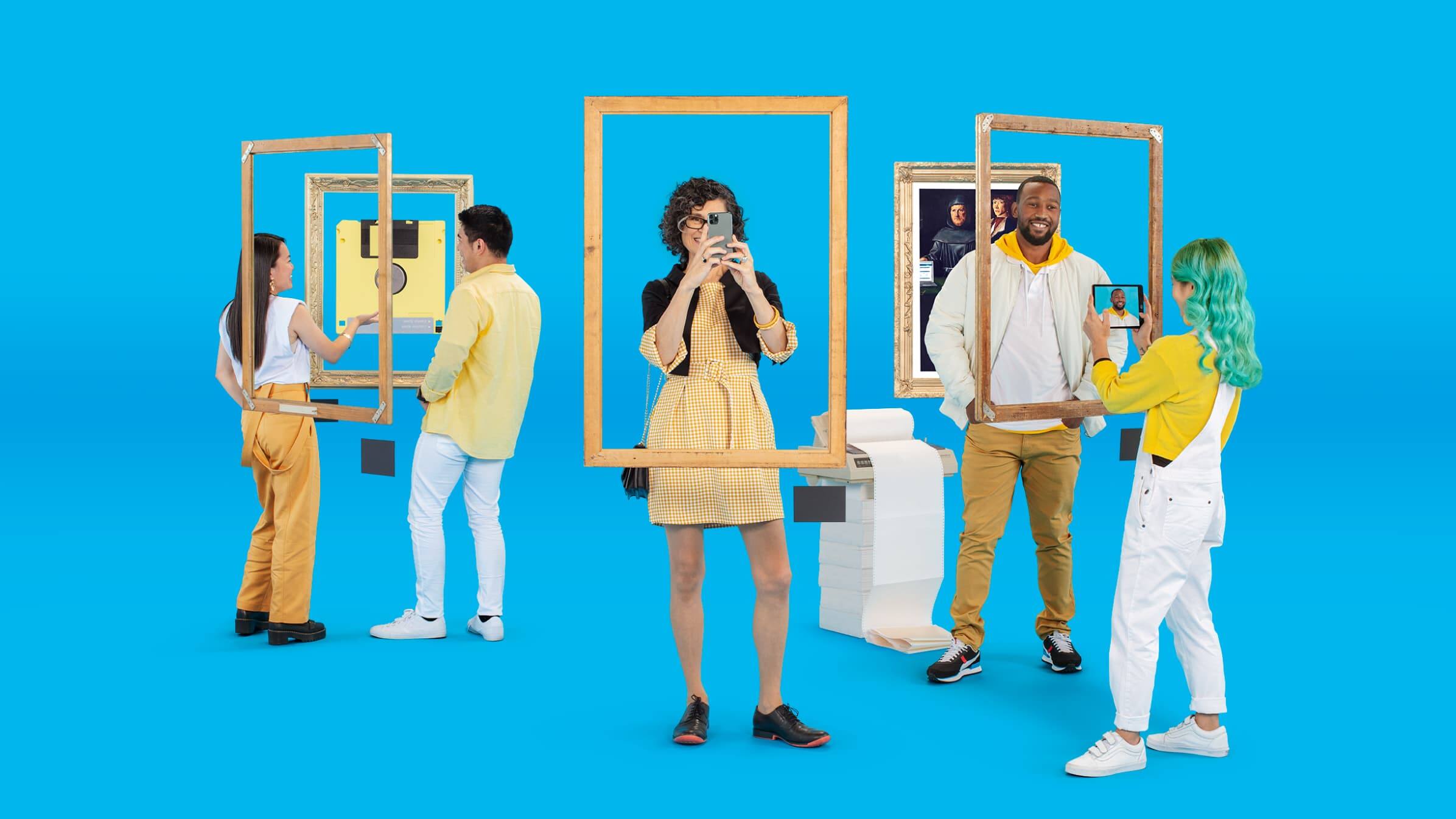 Five people against a blue background looking through floating picture frames at an old floppy disk and an old printer.