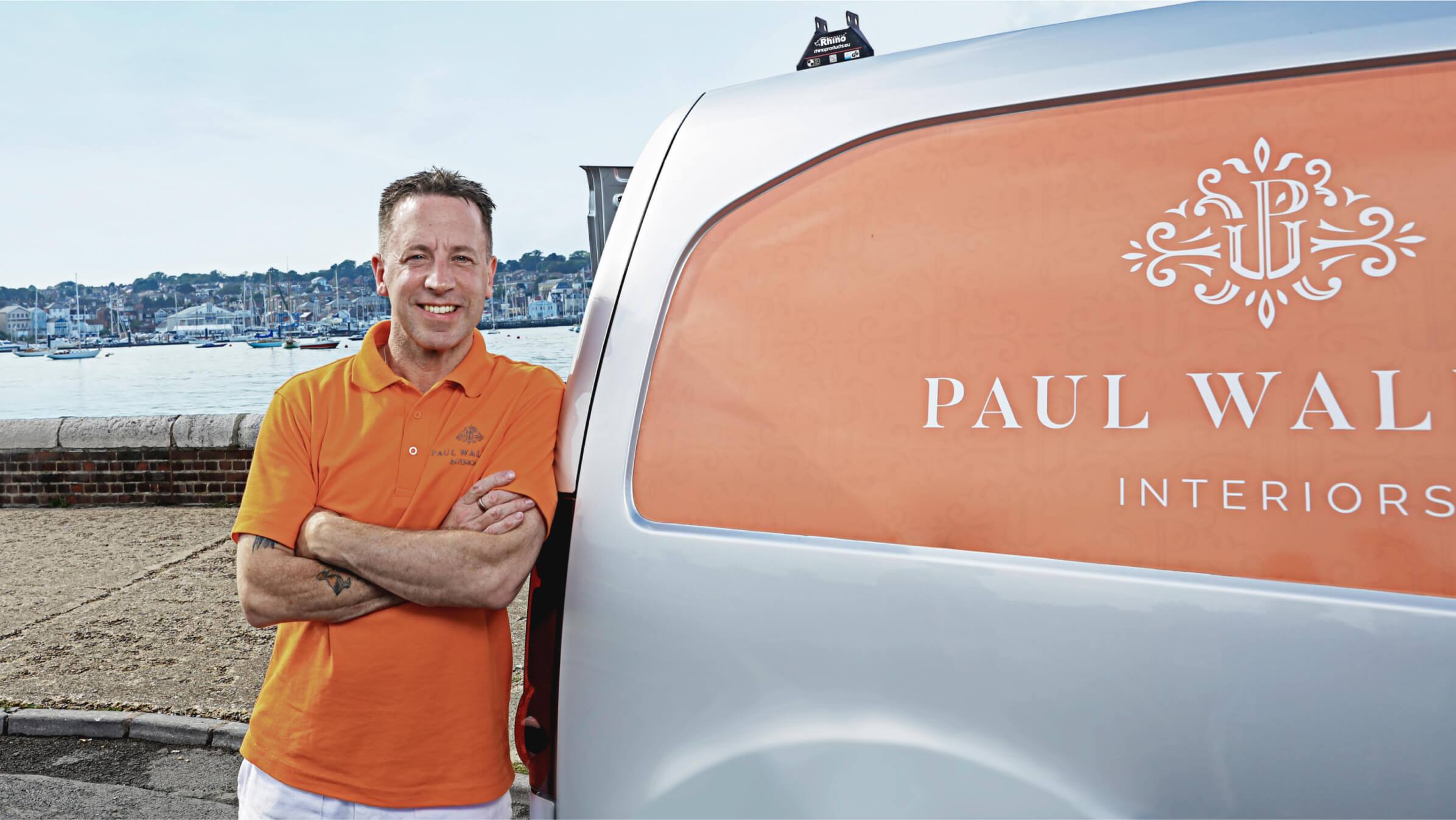 Paul Walden leaning against his van at the harbour on the Isle of Wight.