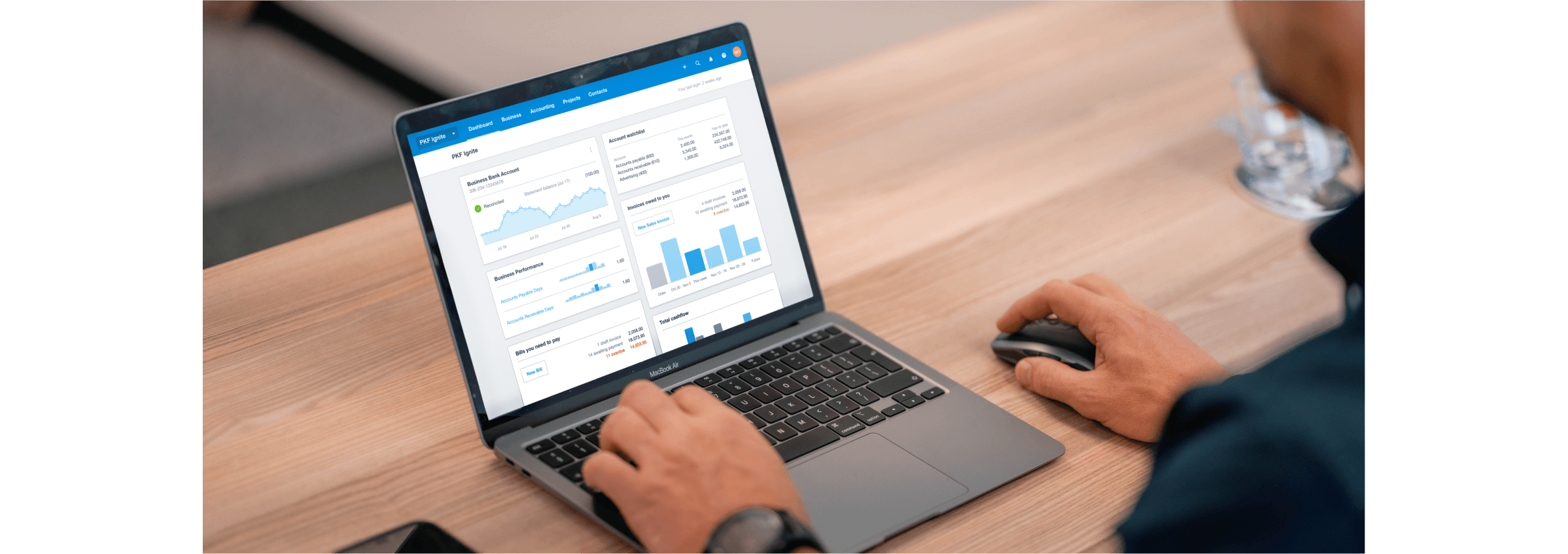 A person checking the Xero dashboard on their laptop.