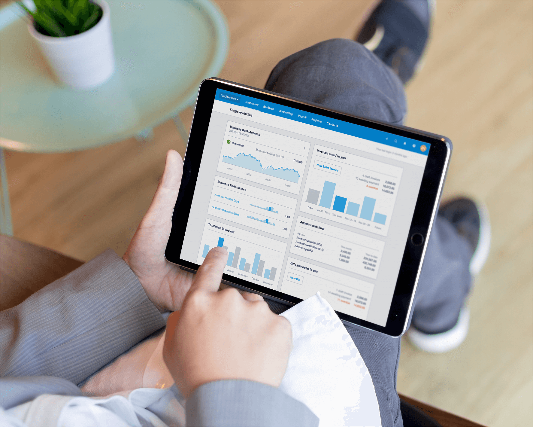Checking business data in Xero on a tablet, preparing to connect with Moula to apply for small business finance. 