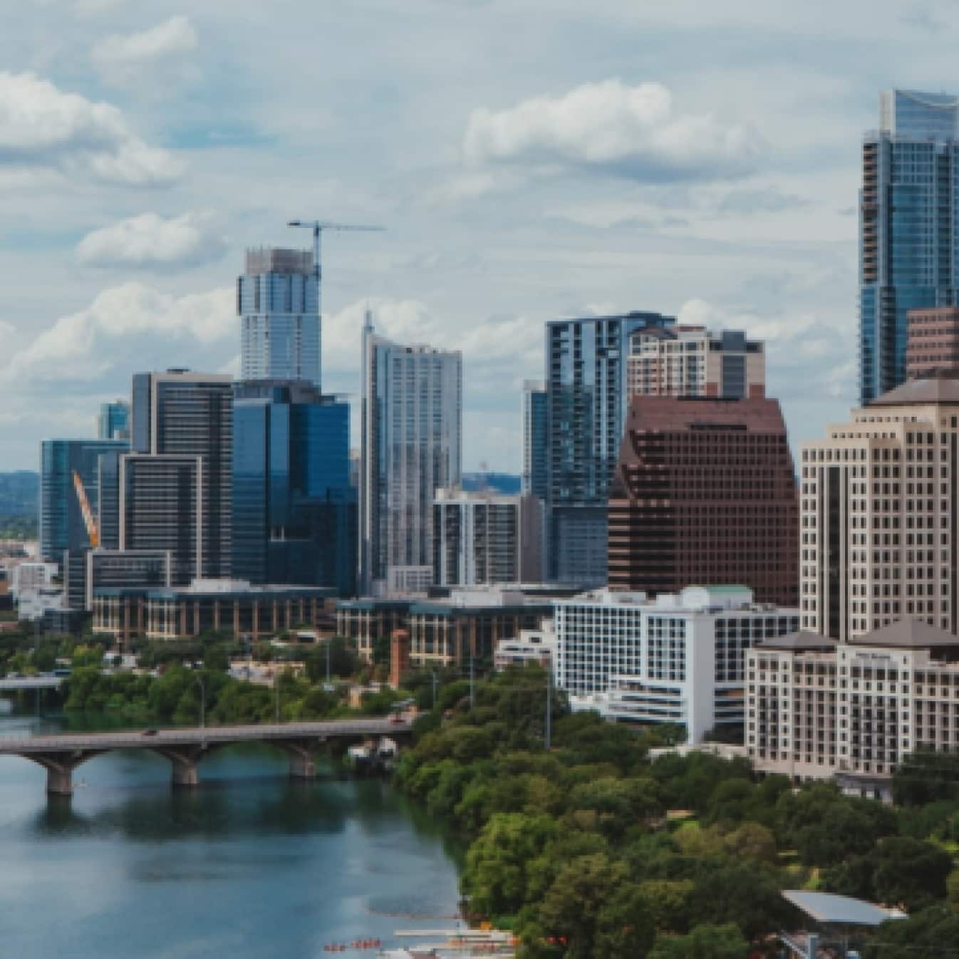 Downtown Austin city buildings and bridges across the Colorado River. 