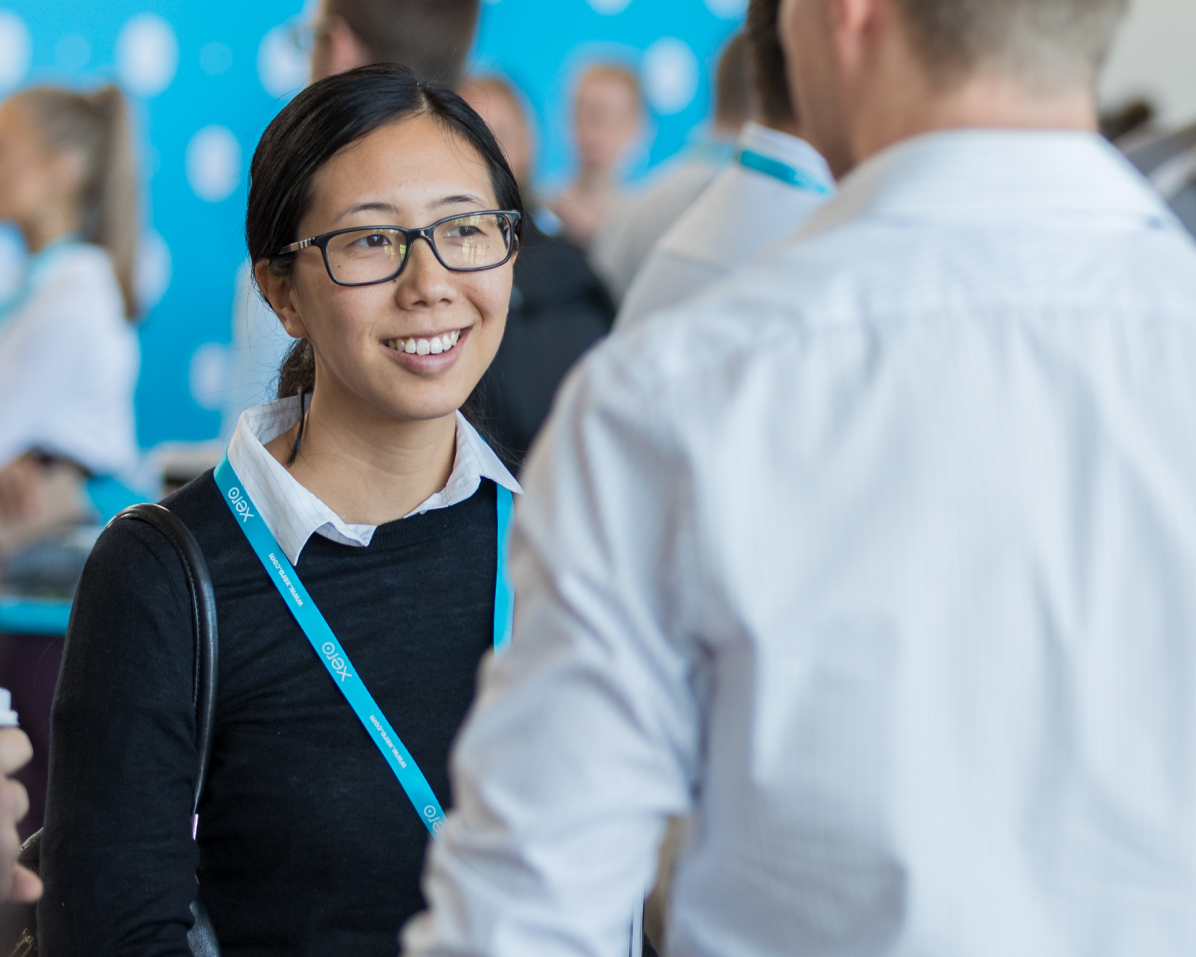 Two participants meeting at a Xero event in Asia.