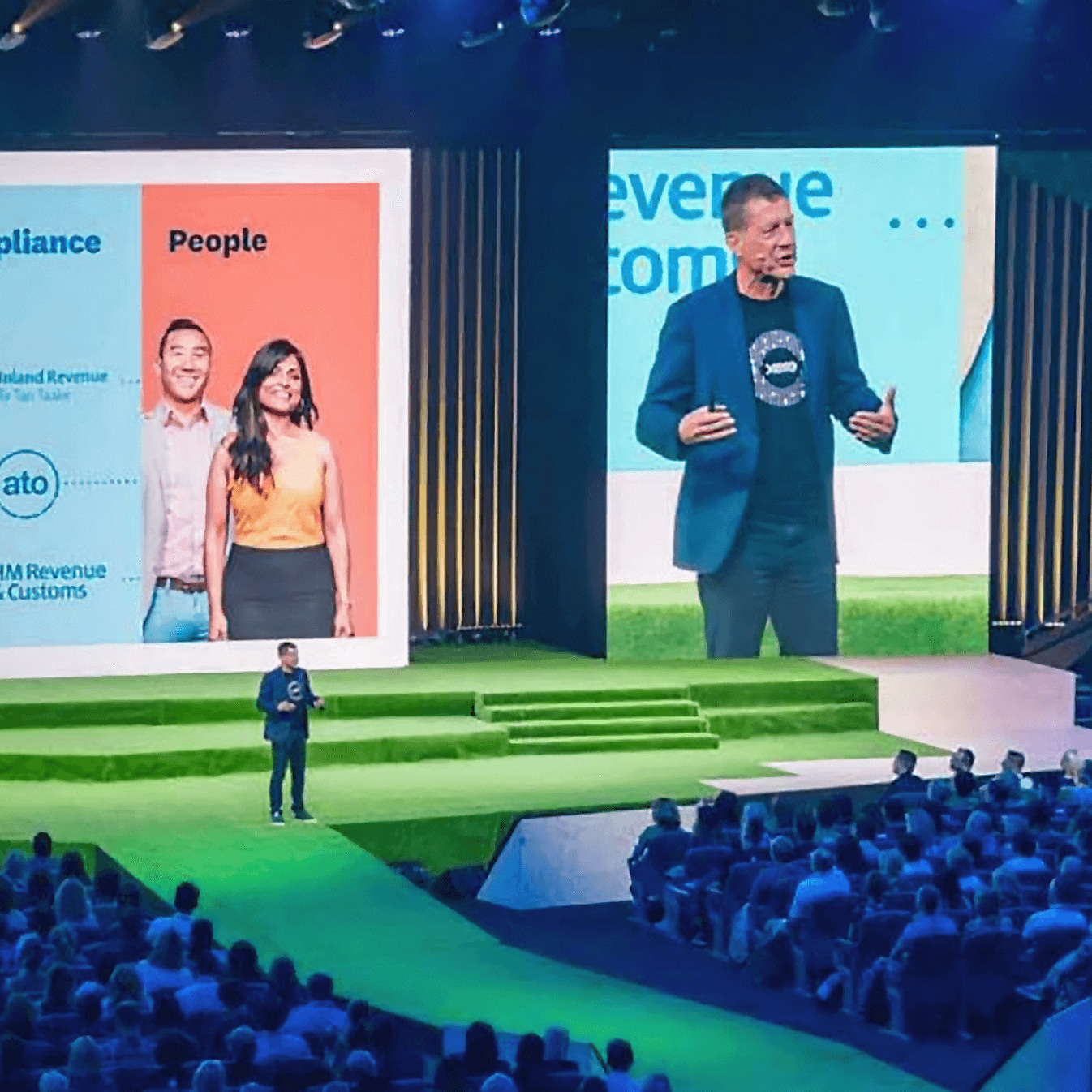 Xero CEO Steve Vamos on a stage presenting to an audience.