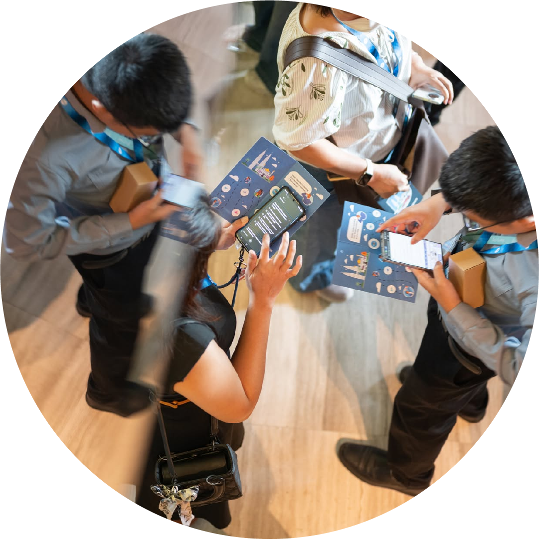 Attendees reviewing Roadshow brochure at Xero Asia Roadshow 2025