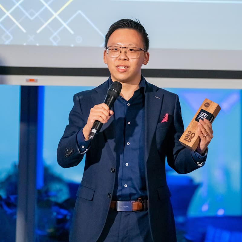 Li Han of WLP Group on stage holding a trophy and delivering his winner’s speech at Xero Asia Awards 2025.