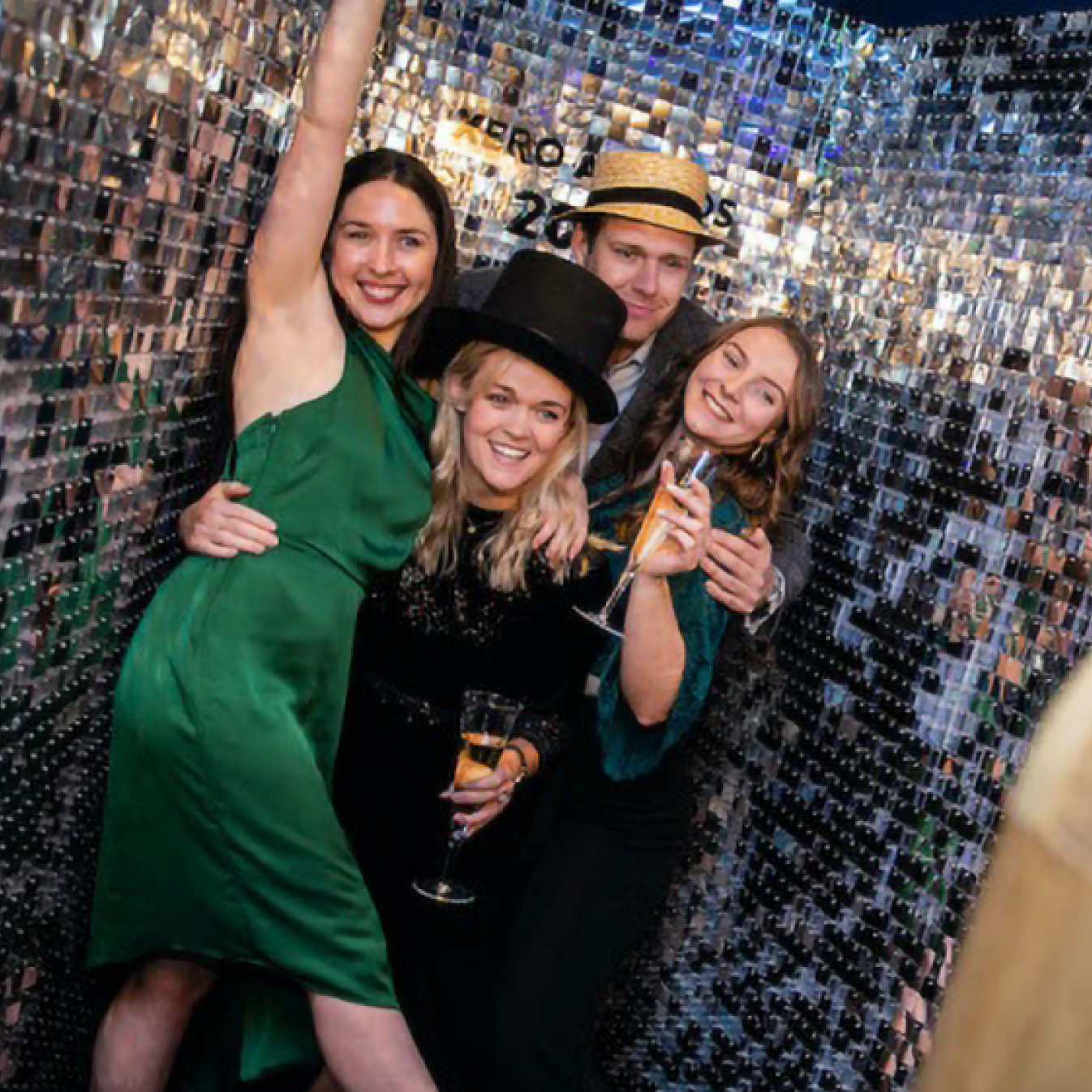 A group of people celebrating with champagne at the Xero awards. 