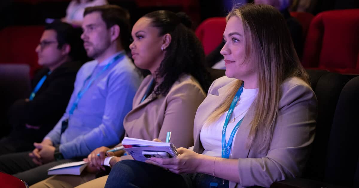 Four audience members listen attentively at Xero Talks event