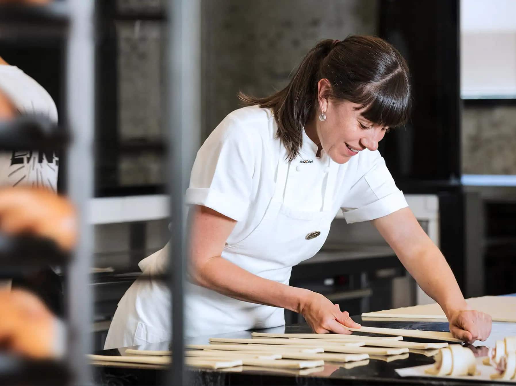 Australian small business owner in her bakery managing finances with Xero accounting software