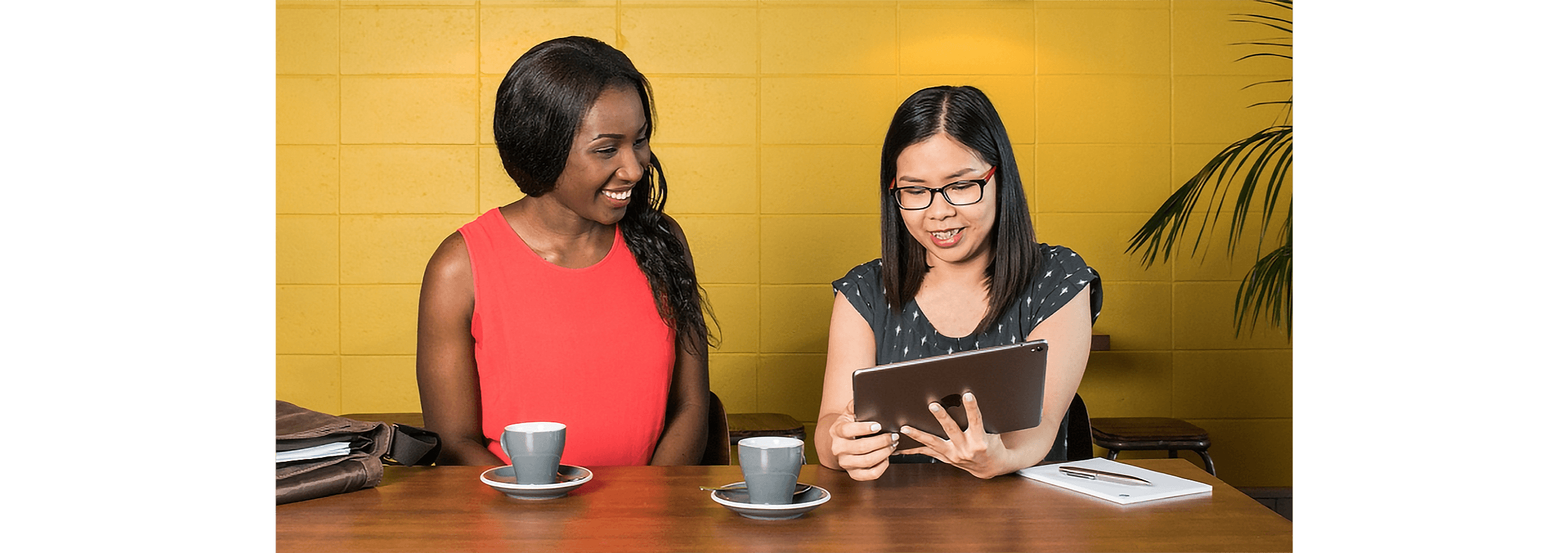 An accountant demonstrates Xero to a client in a meeting room.