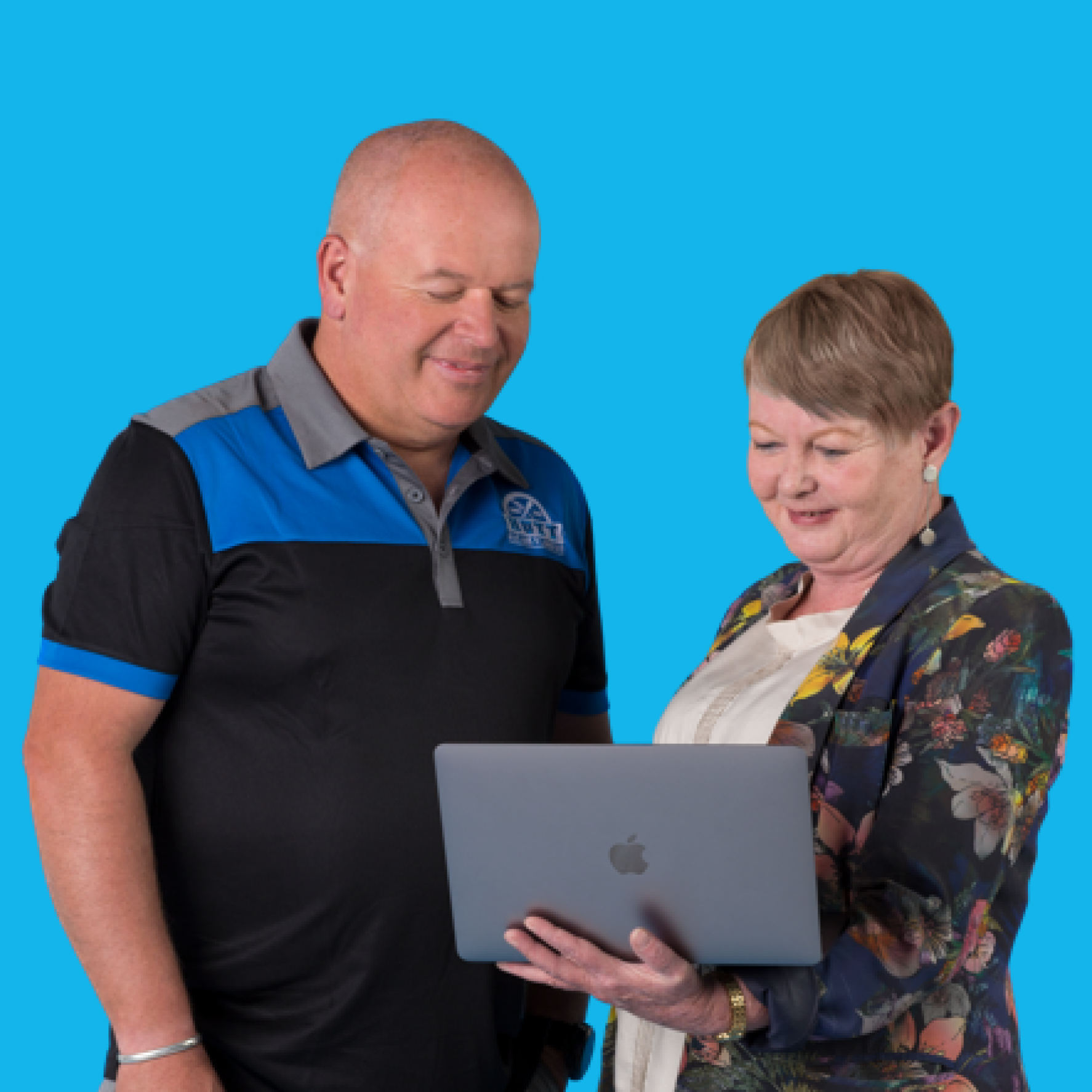 Two business owners using HMRC-recognised payroll software.