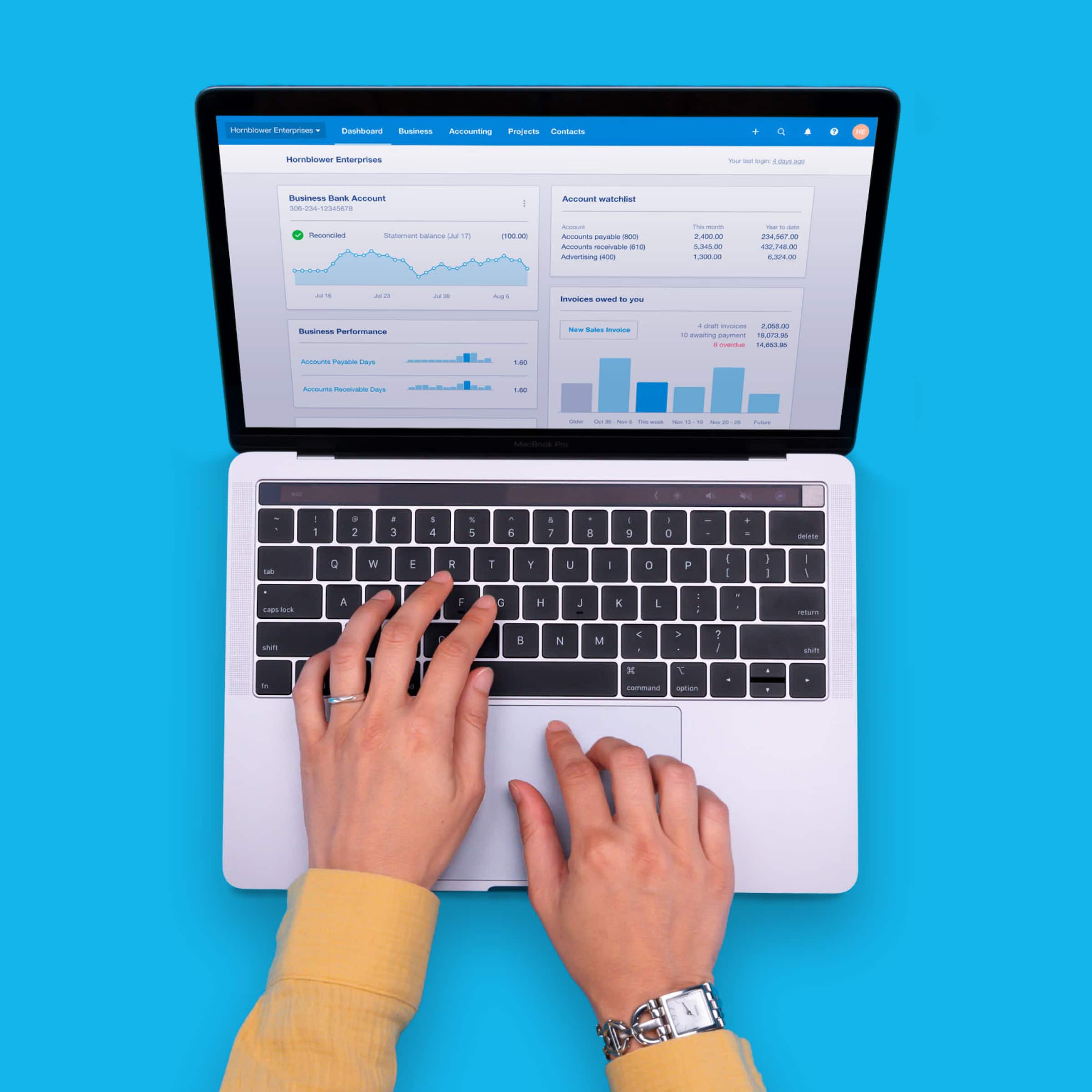 An Apple Mac displays charts and tables in Xero’s accounting software