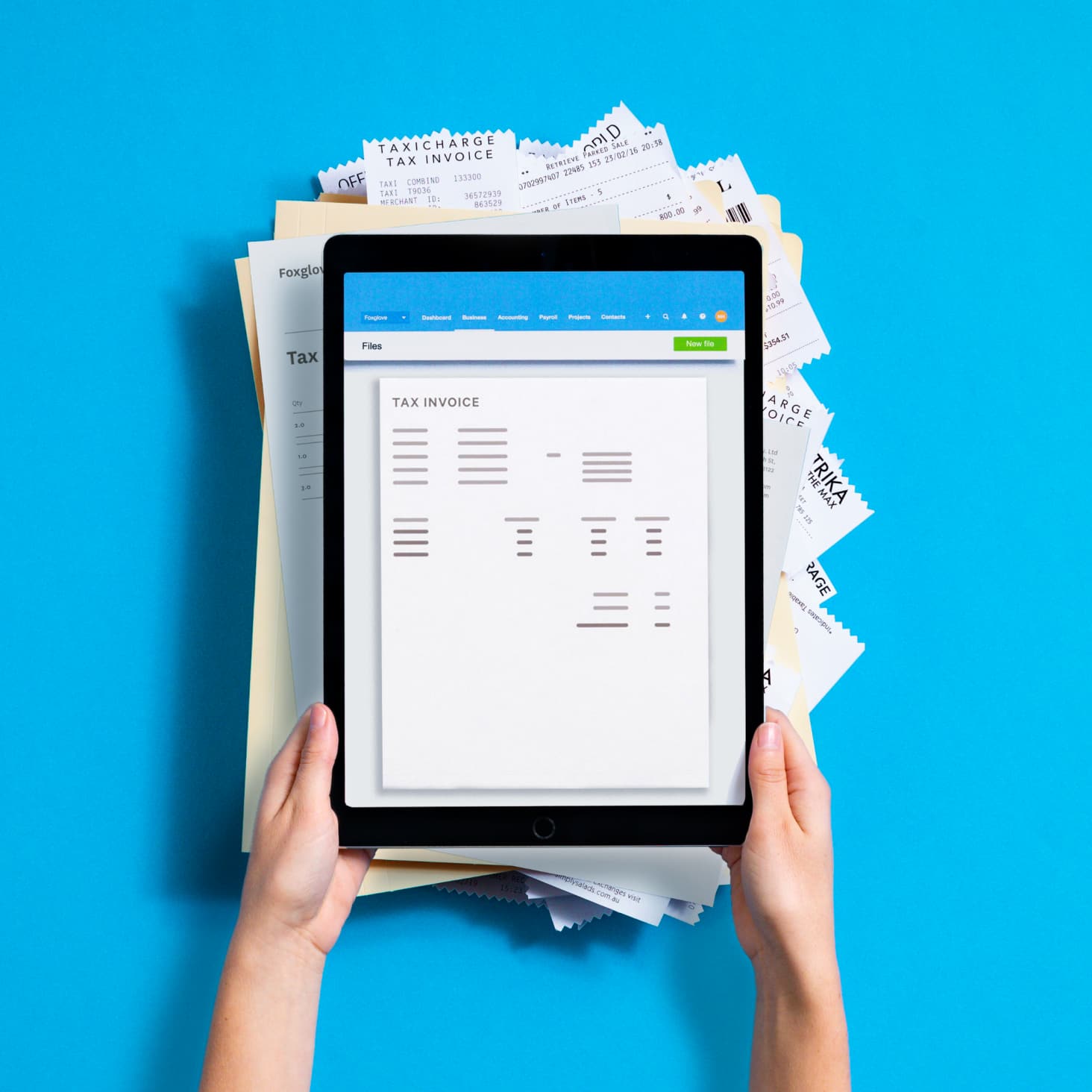 Tax invoice on tablet, categorised for online file storage.