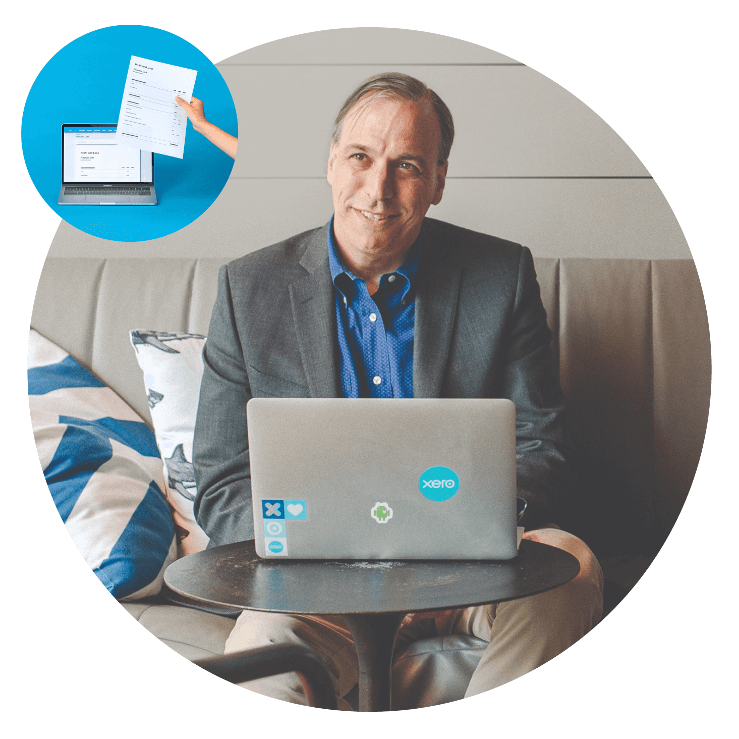 An accountant works at a laptop covered with Xero stickers. 