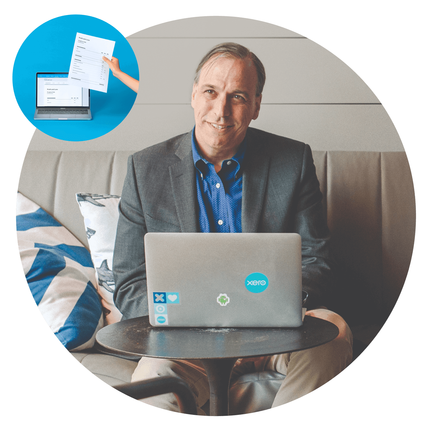An accountant works at a laptop covered with Xero stickers.