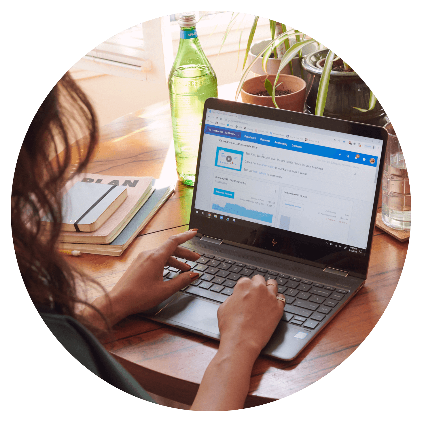 Two hands entering information into Xero on a laptop.
