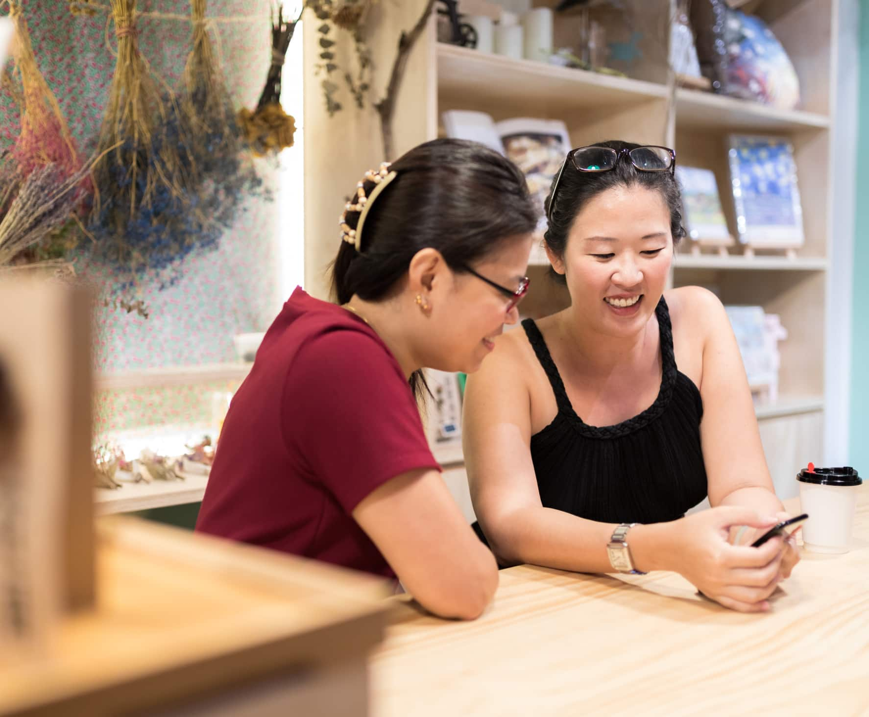 Picture of two women looking at their phone screen